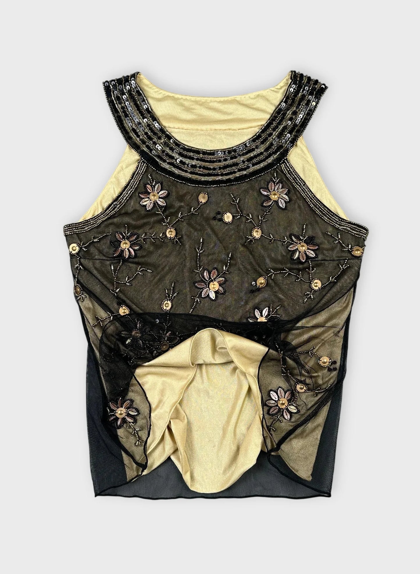 Detail view of a black embroidered sheer top with beaded floral details.