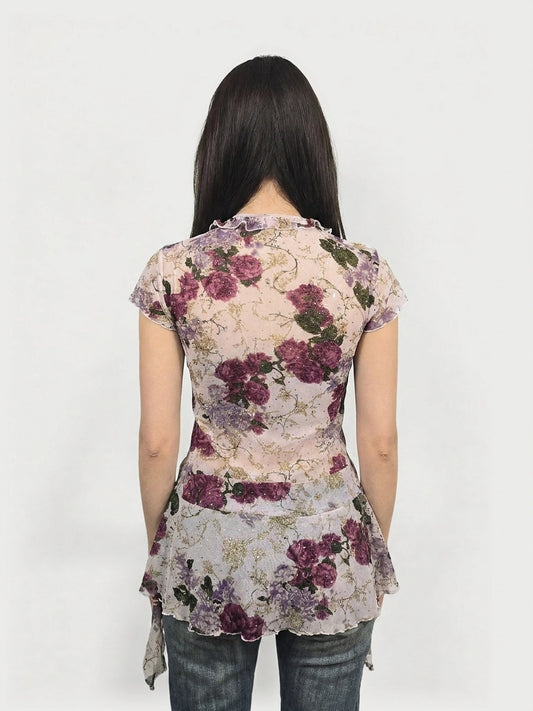 Back view of a floral frill mesh top in purple with ruffled neckline.
