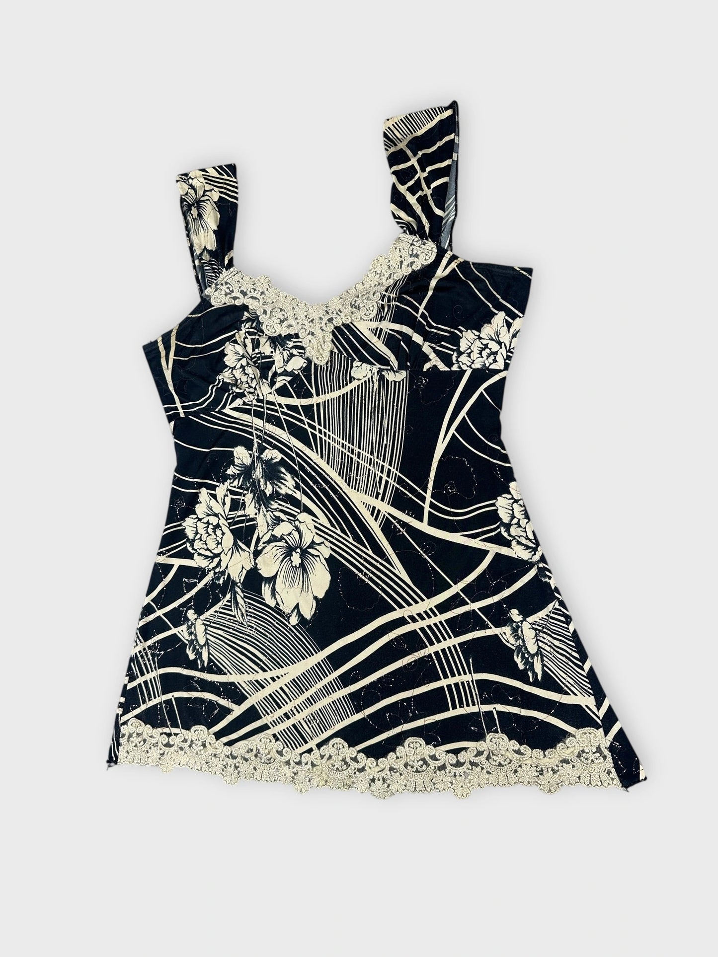 Detail view of a black floral lace trim tank top with wide straps.