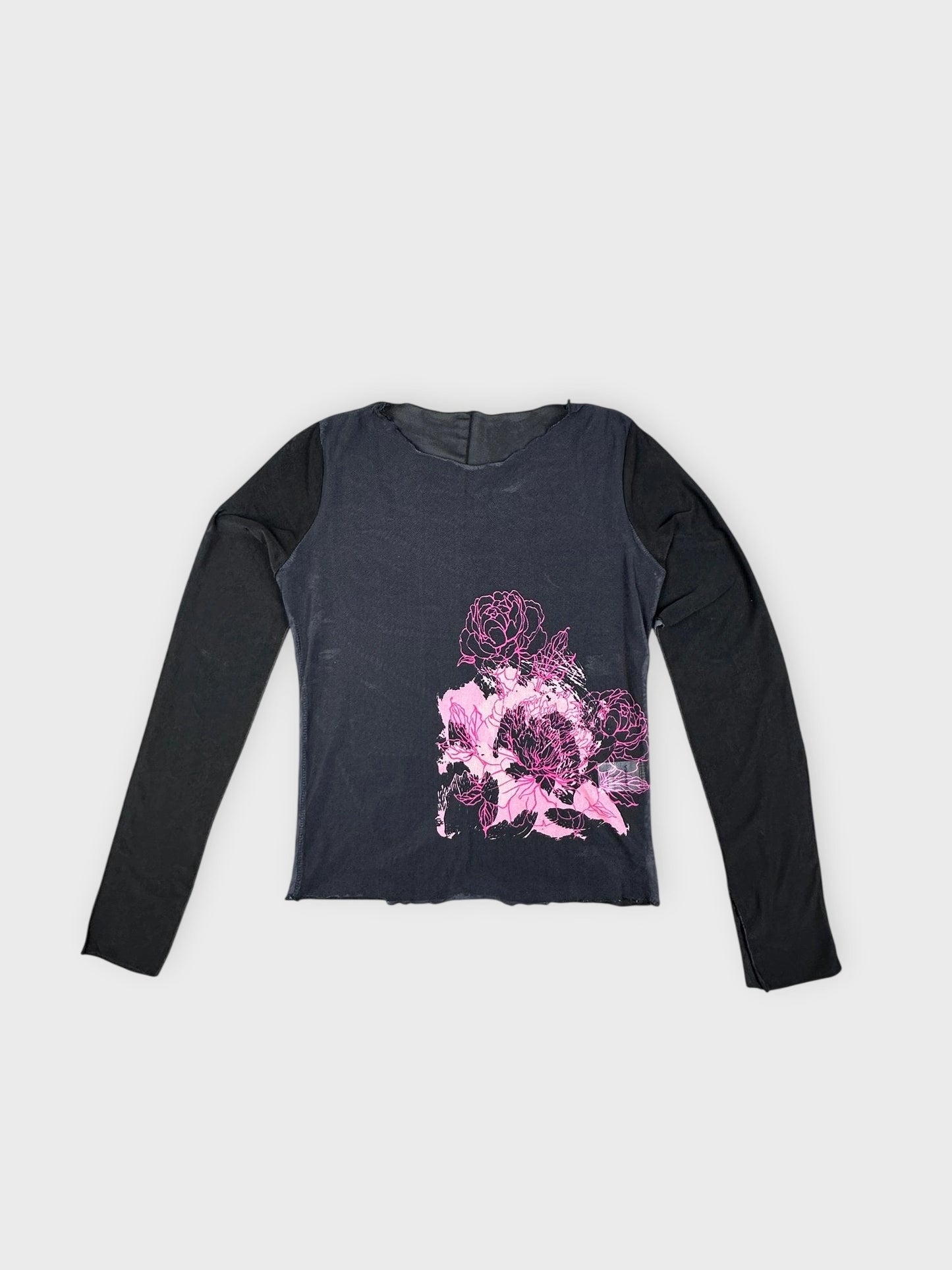 Floral layered top in black with pink floral print detail view.