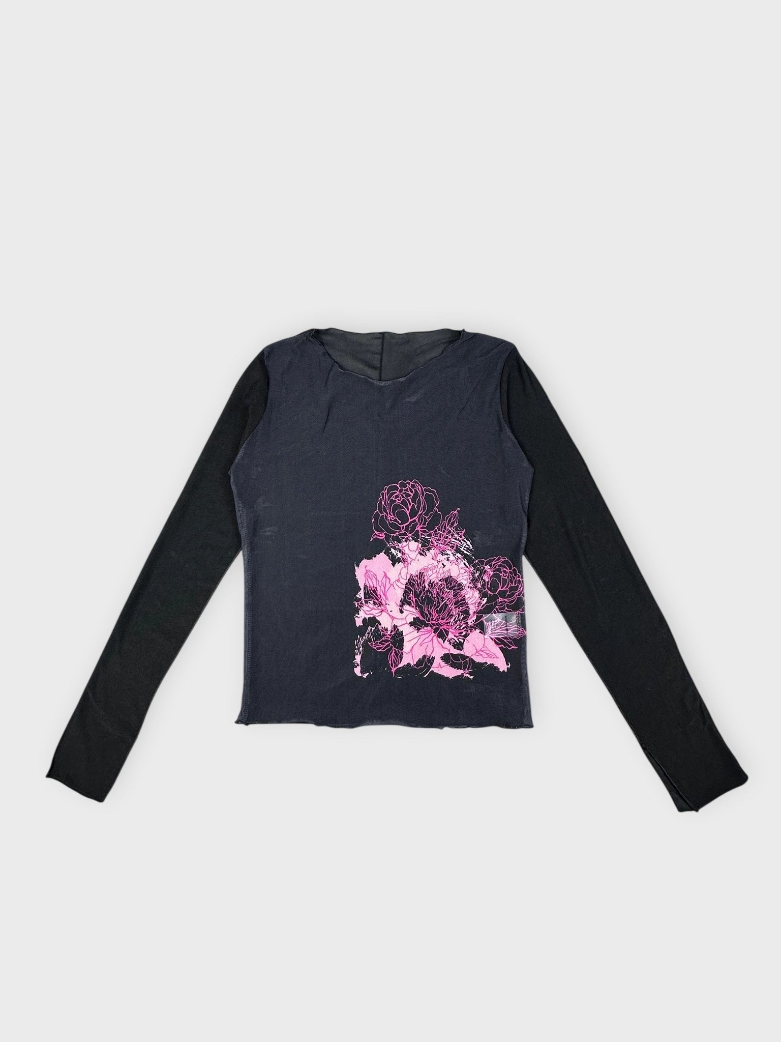 Front view of a floral layered top in navy with a pink floral print.