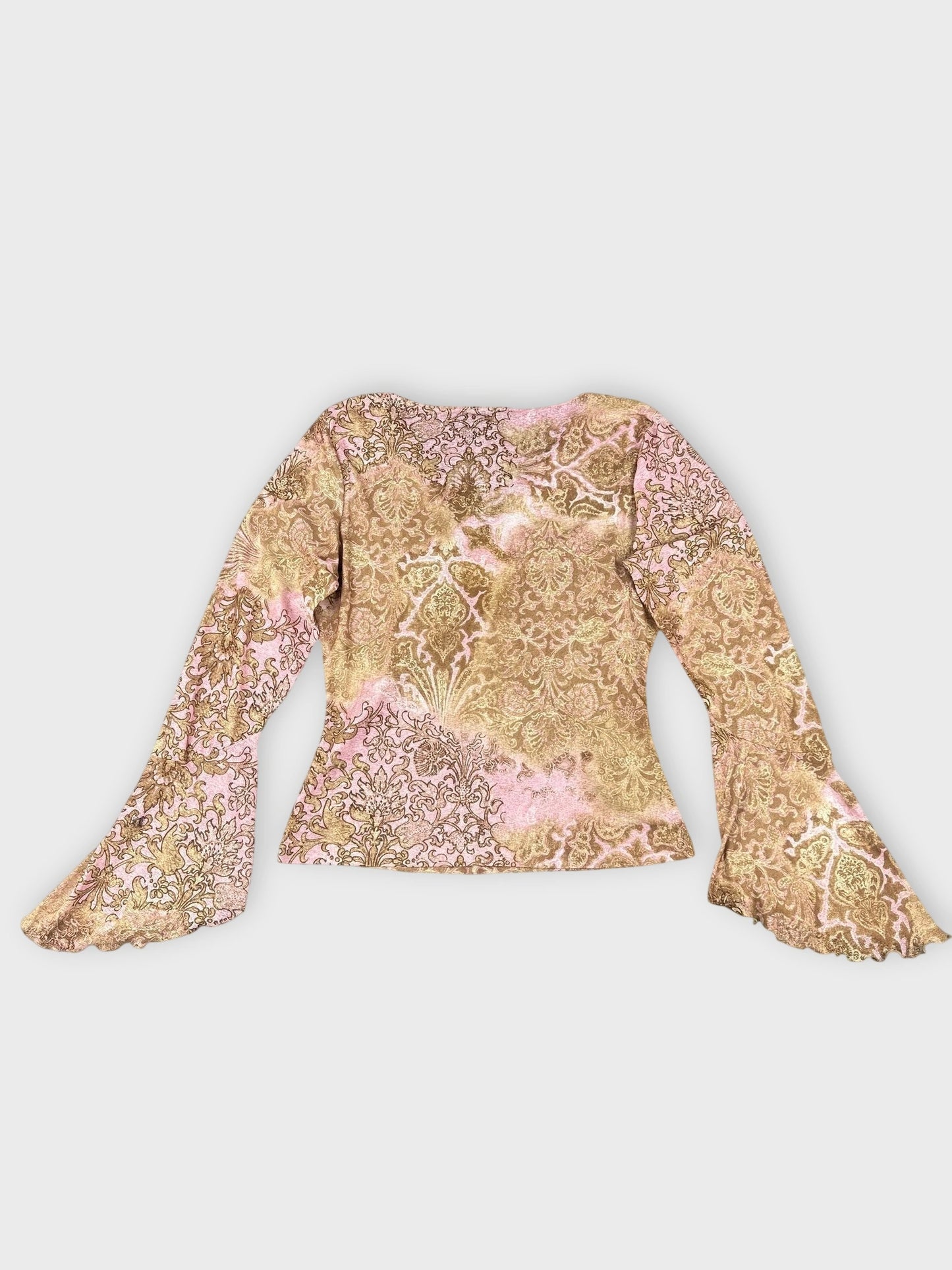 Back view of floral long sleeve top with pink and gold patterns.