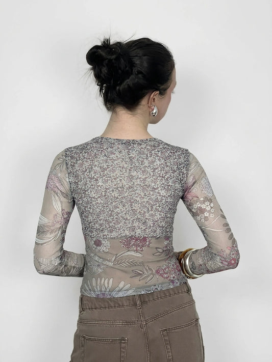 Back view of floral mesh long sleeve top with lace detail in gray.