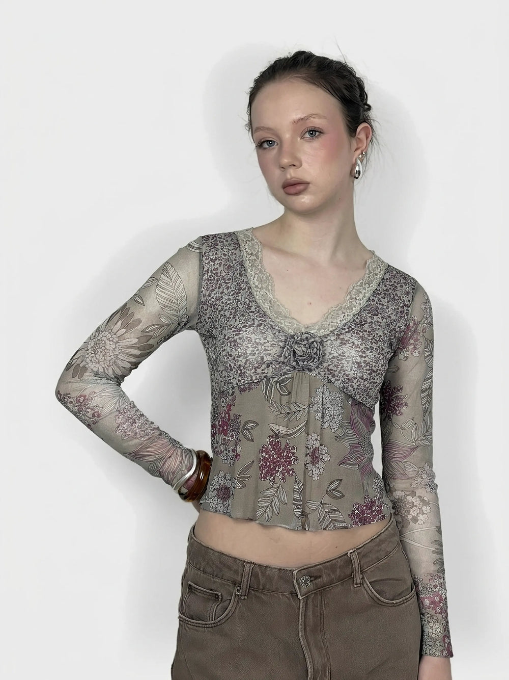 Floral mesh long sleeve top in beige with lace detail, front view.