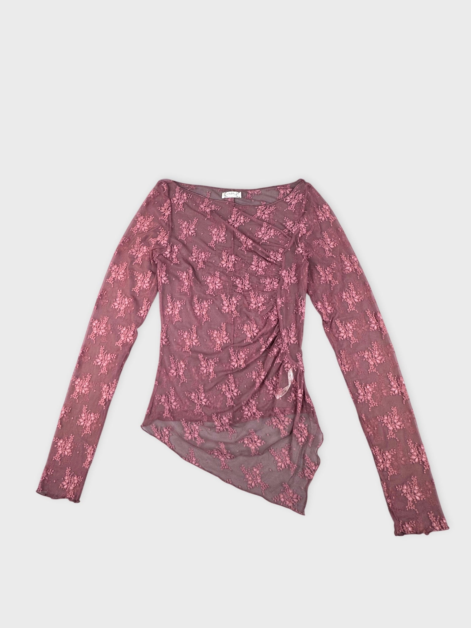Front view of a floral mesh top in mauve with an asymmetrical shape.