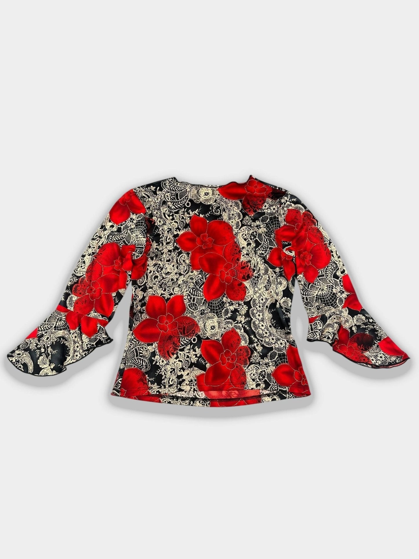 Back view of a floral ruffle sleeve top in red and black pattern.