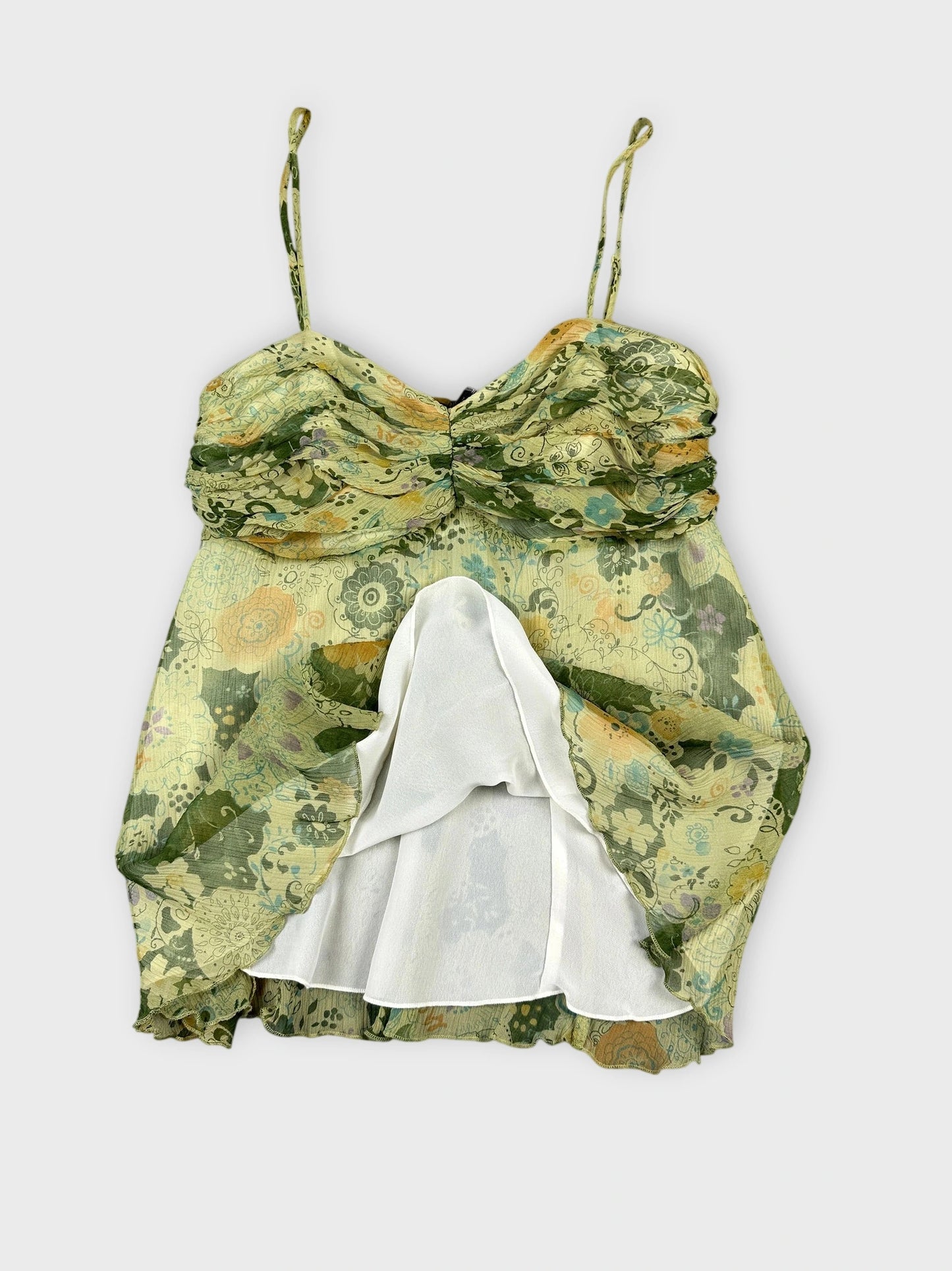 Floral silk cami top in green with sweetheart neckline detail view.