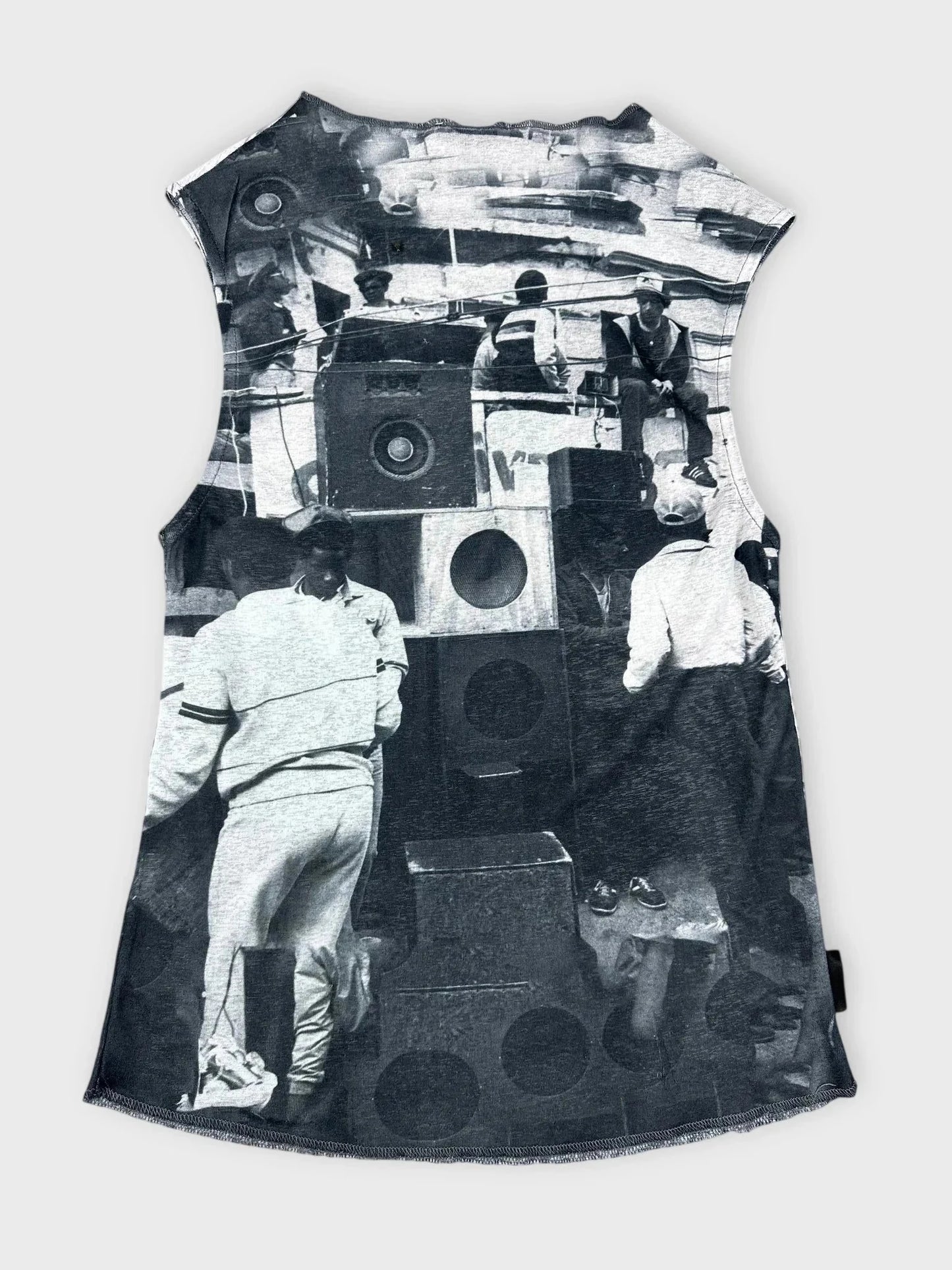 Back view of sleeveless black graphic print top featuring a vintage scene.