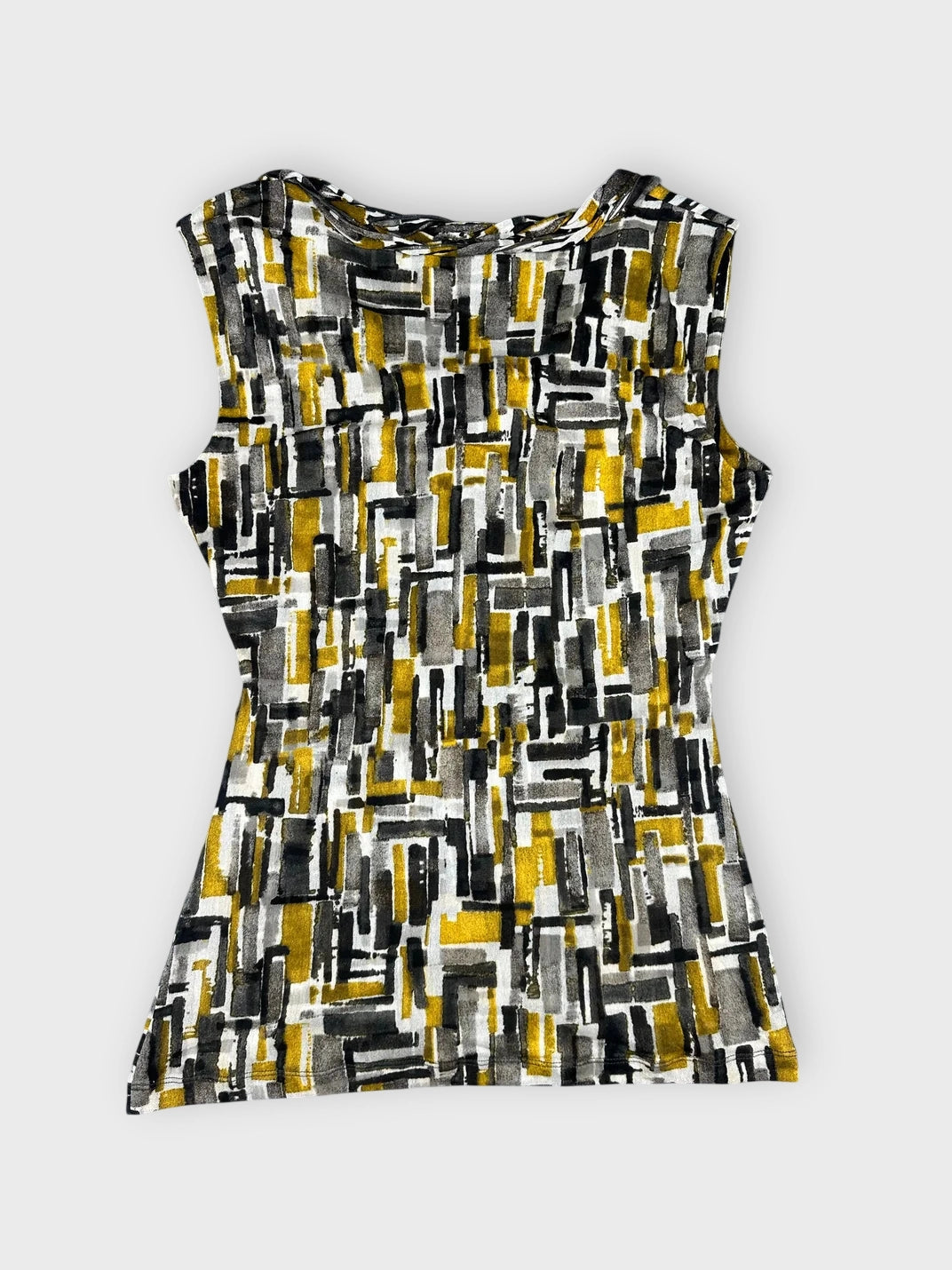 Back view of a sleeveless top in yellow grey and black geometric print.