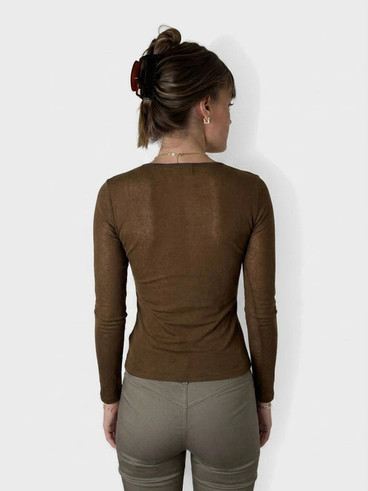Back view of a brown longsleeve top featuring text print.