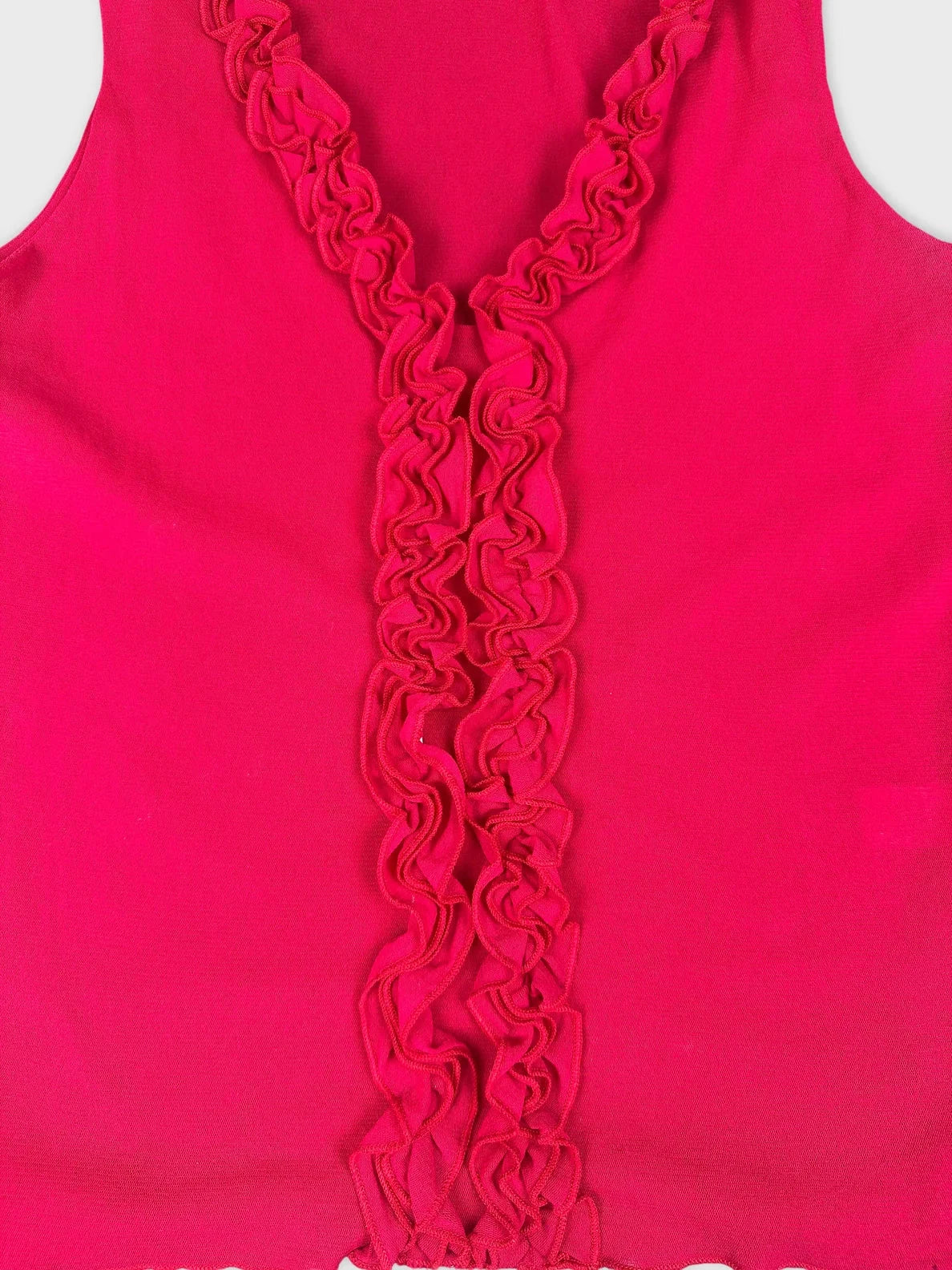 Detail view of hot pink tank top featuring a ruffled front design.