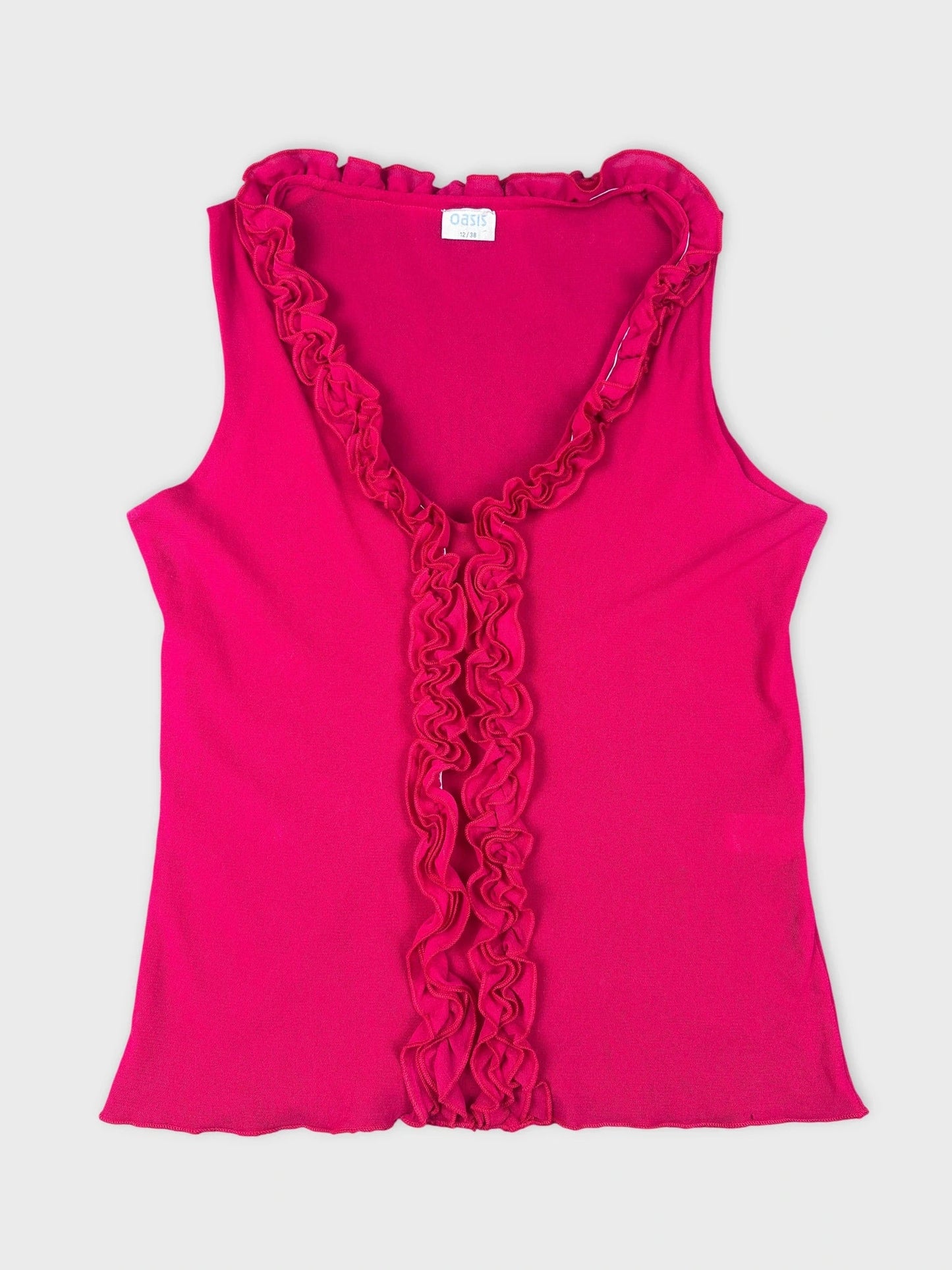 Hot pink ruffled tank top front view with prominent ruffle detail