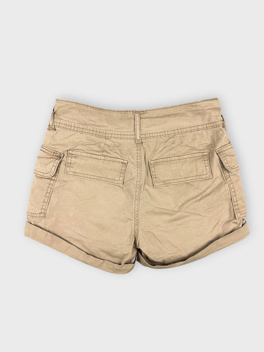 Back view of khaki mini cargo shorts with side straps and pockets.