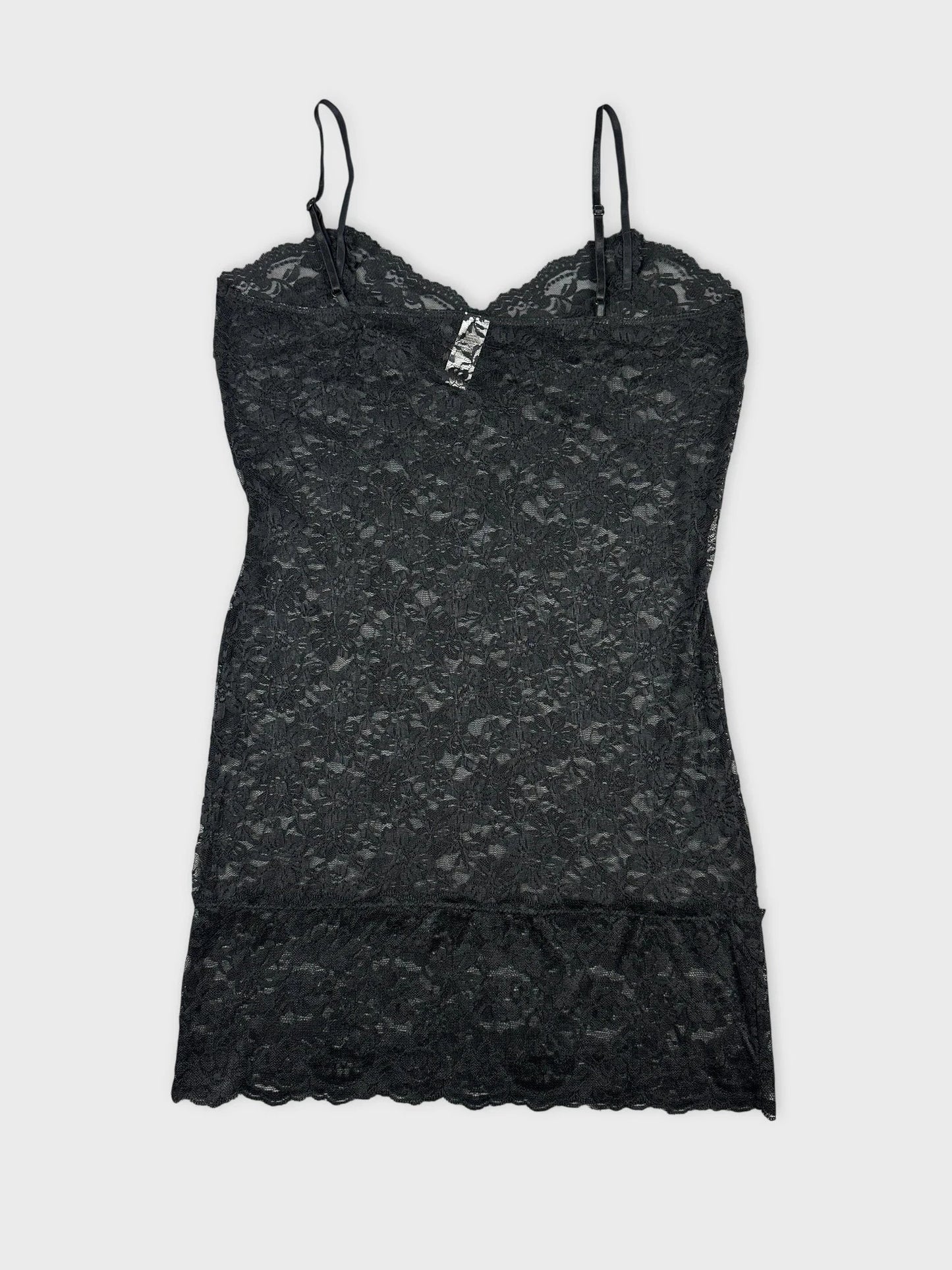 Lace cami top in black with floral pattern back view.