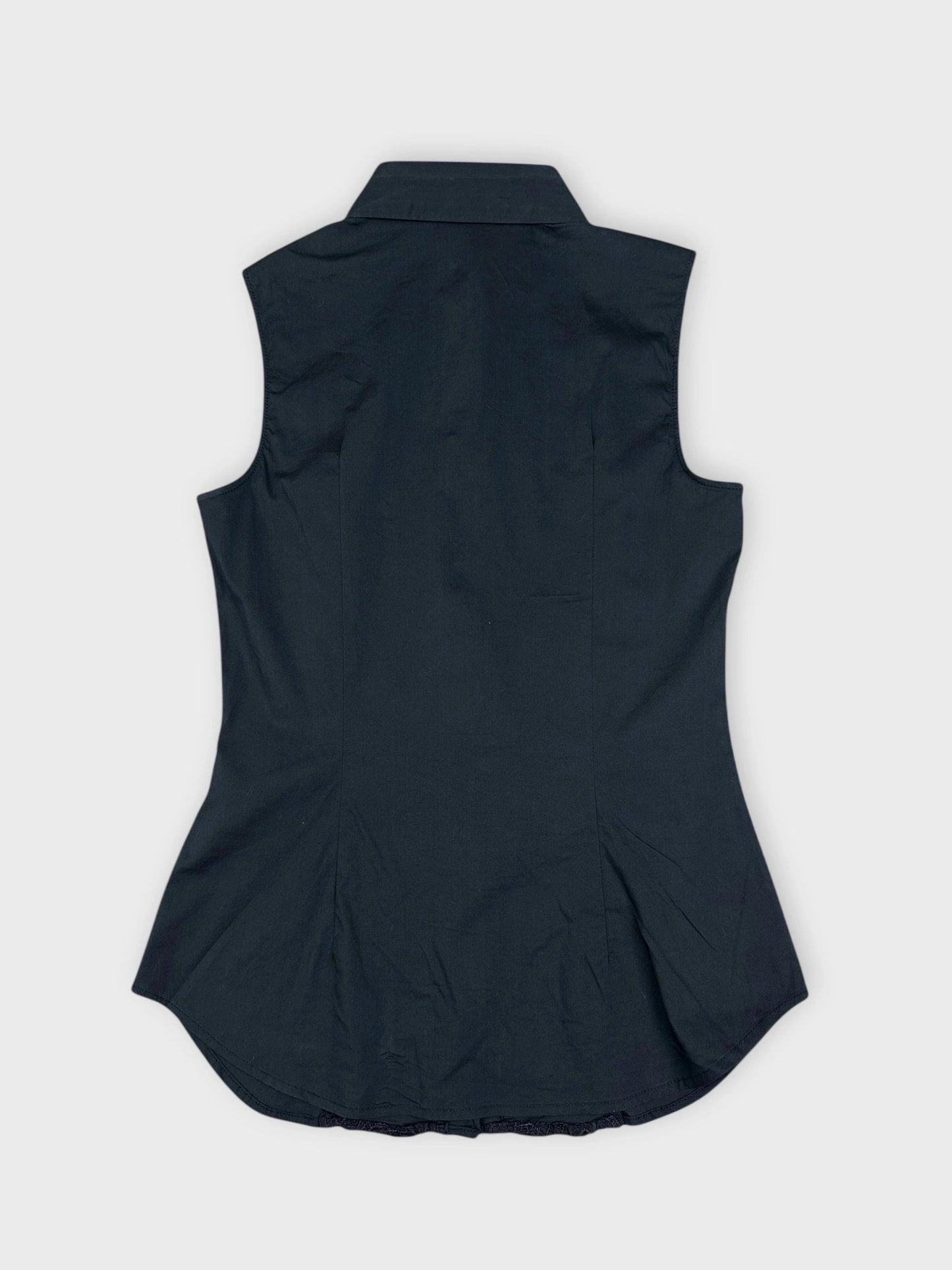 Back view of a black blouse featuring lace trim details.