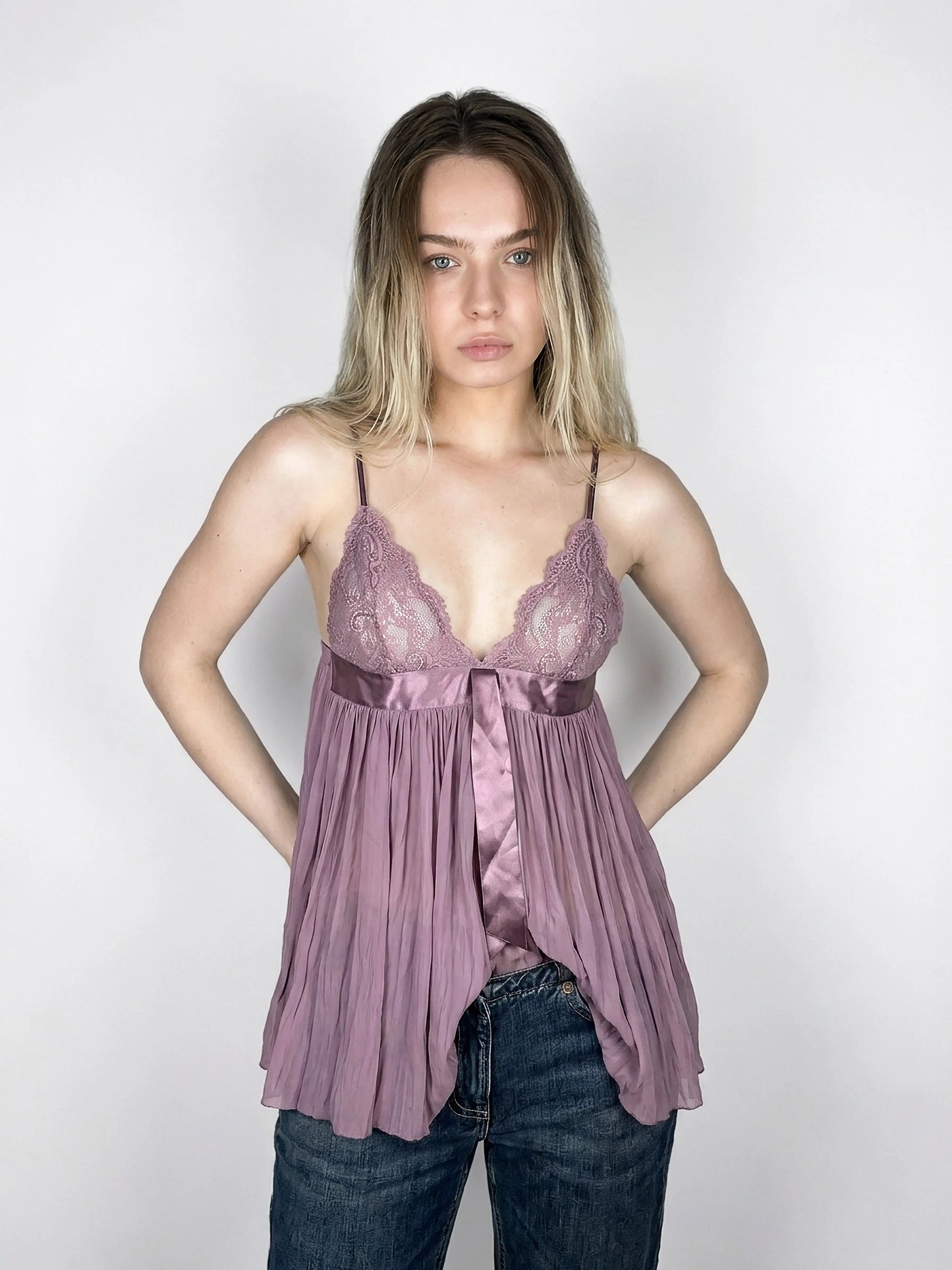Lavender lace bralette with silk detailing, front view, featuring pleated design.