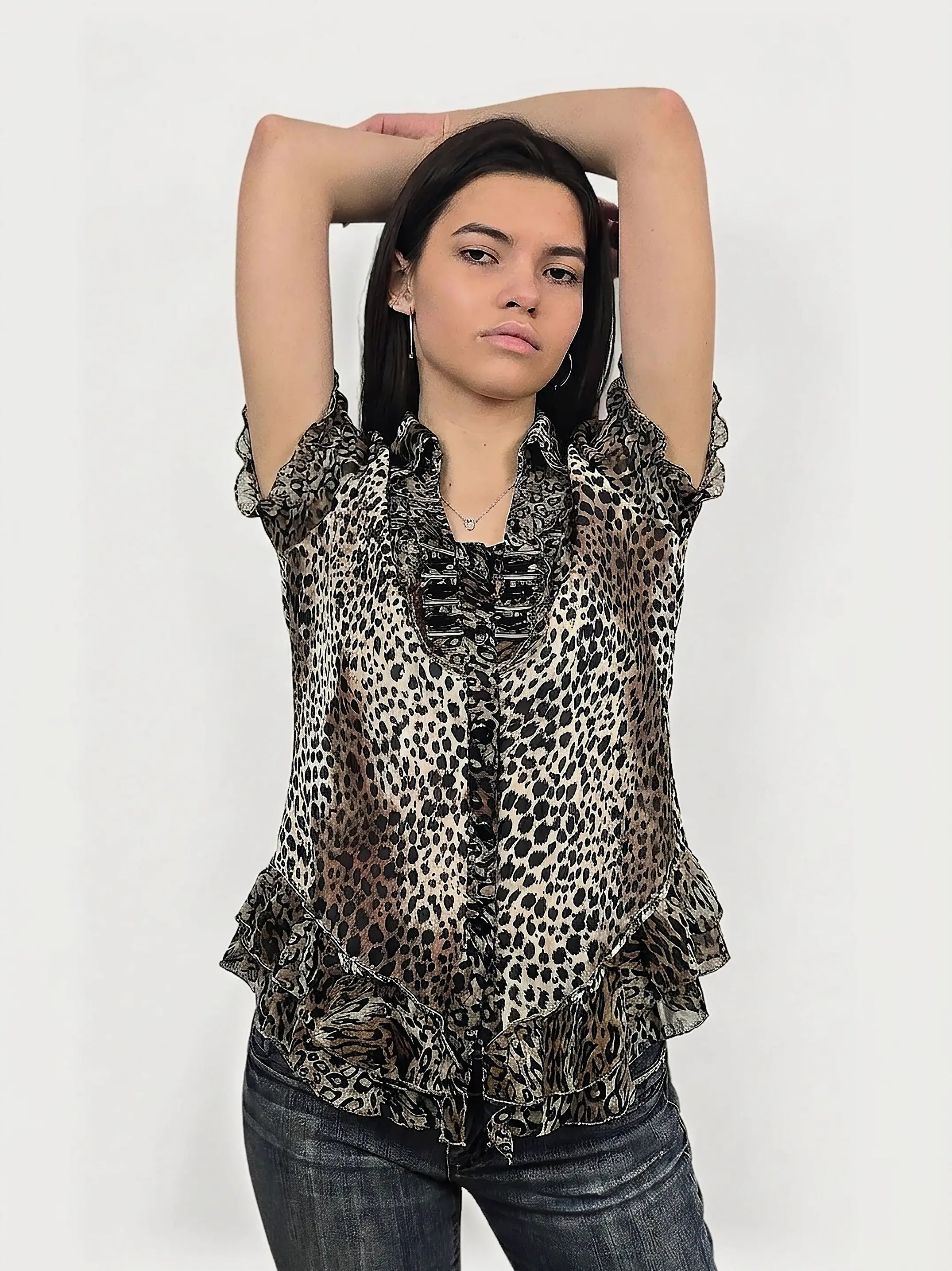 Leopard print button-up top with ruffles, front view.