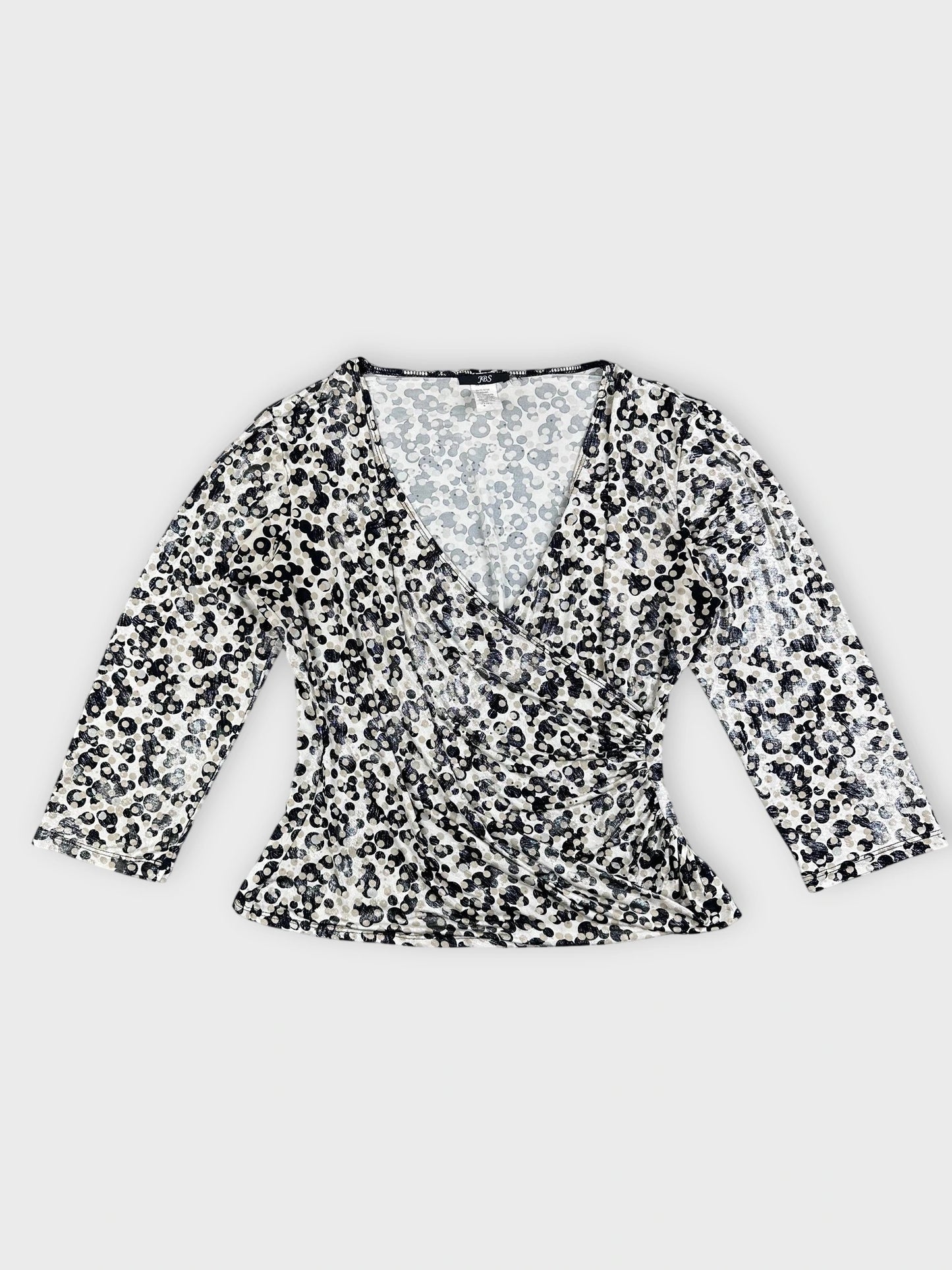 Leopard print long sleeve top in black and white front view.