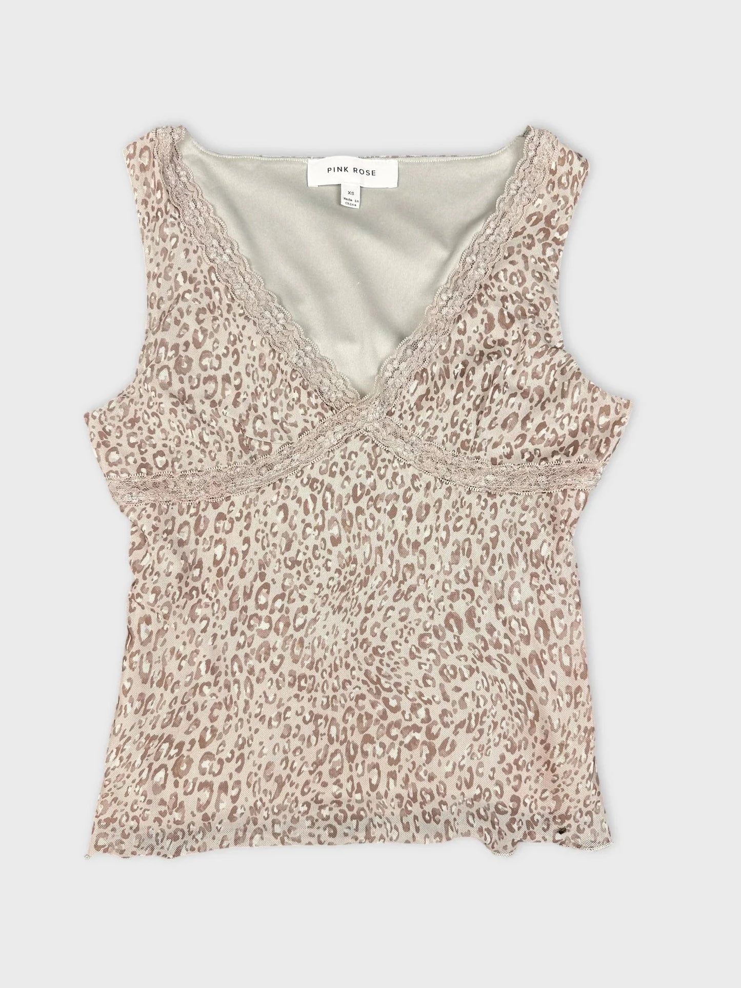 Leopard print short sleeve top in beige back view with lace detailing.