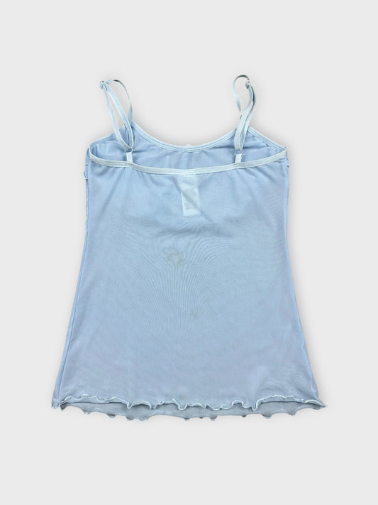 Back view of light blue camisole featuring ruffle trim at neckline.