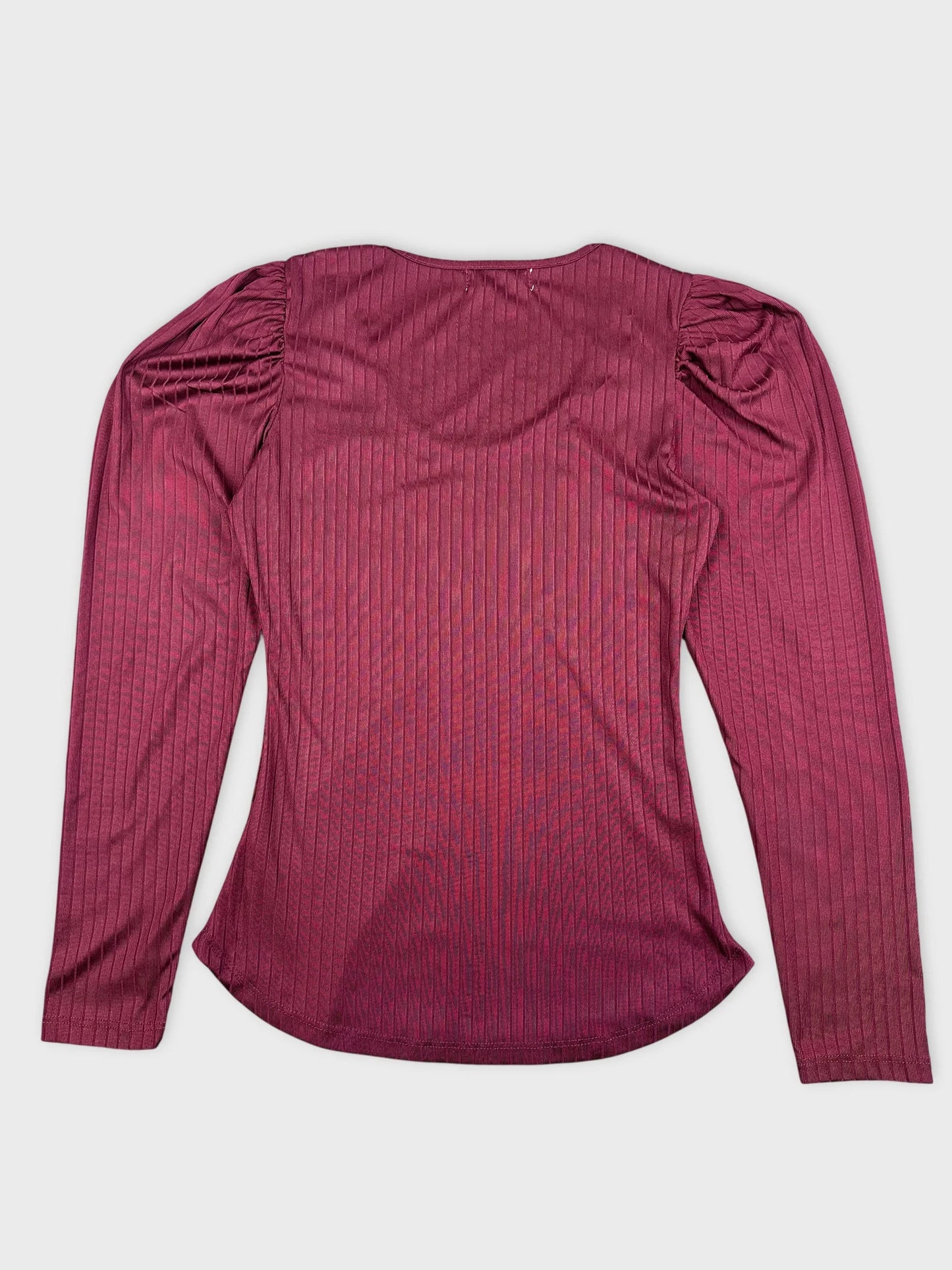 Back view of a maroon ribbed long sleeve top with puffed sleeves.