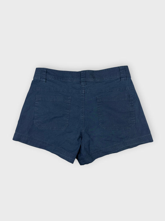Navy cotton mini shorts back view with two pockets and neat stitching.
