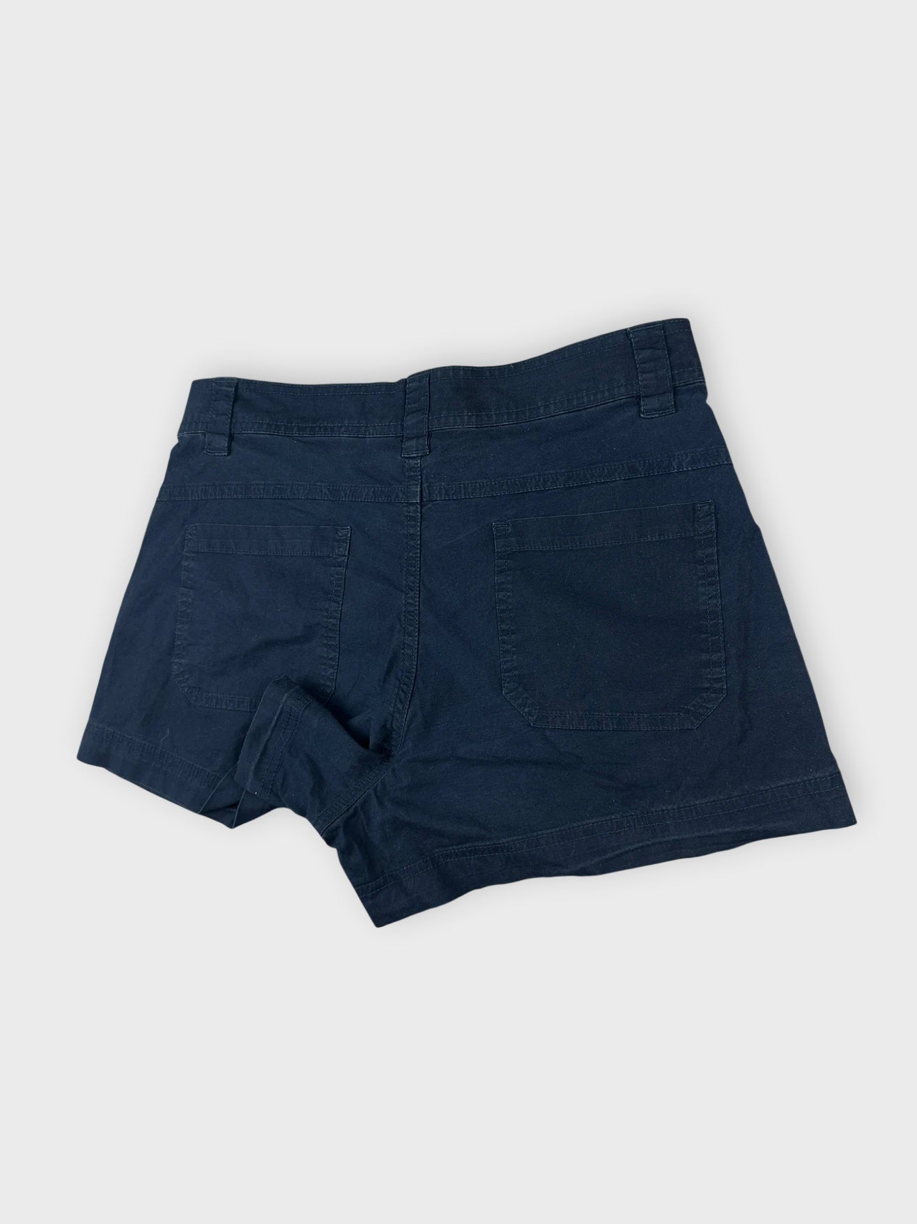 Detail view of navy cotton mini shorts with pockets