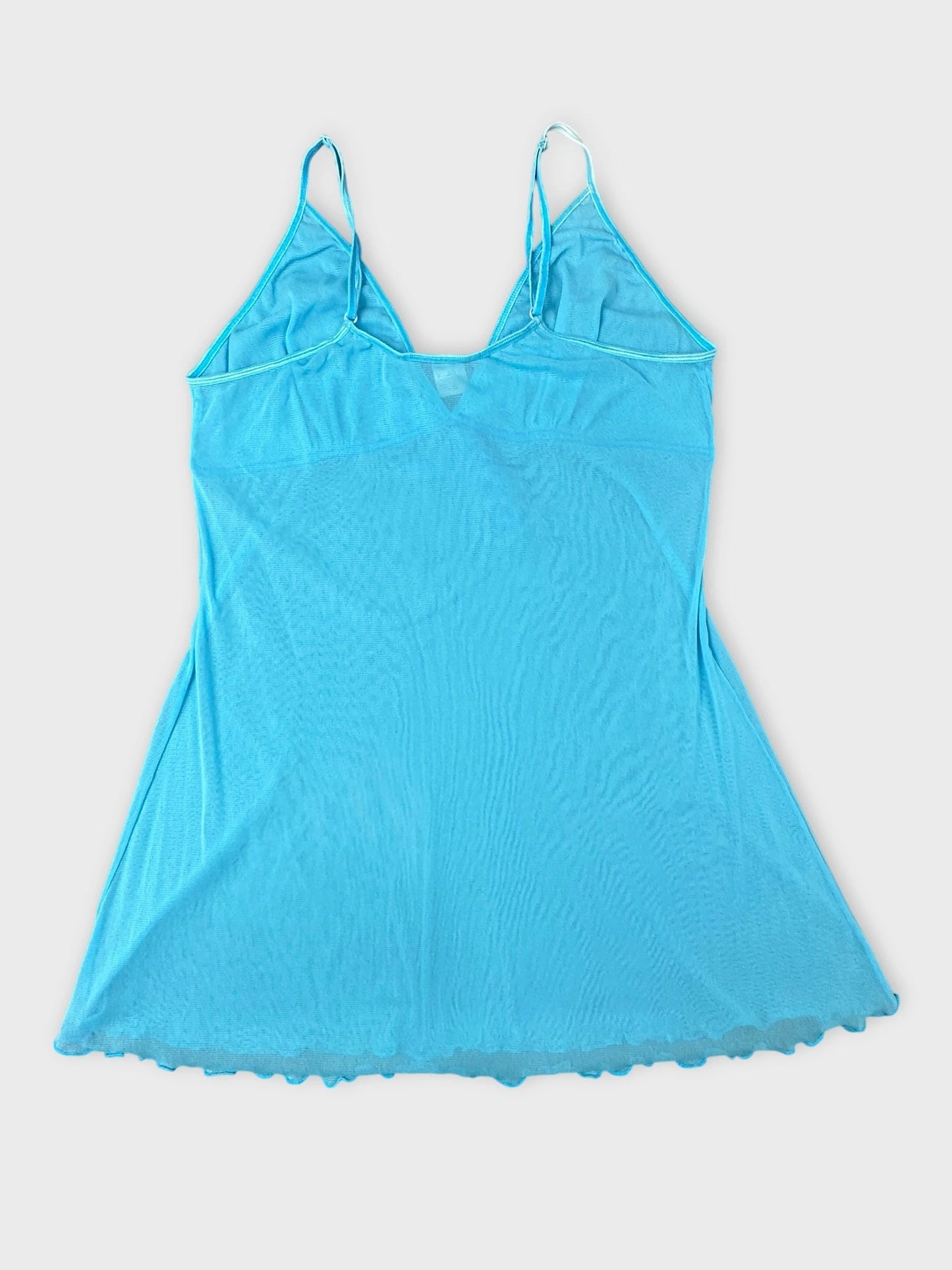 Back view of ocean blue sheer camisole with bow detail and spaghetti straps.