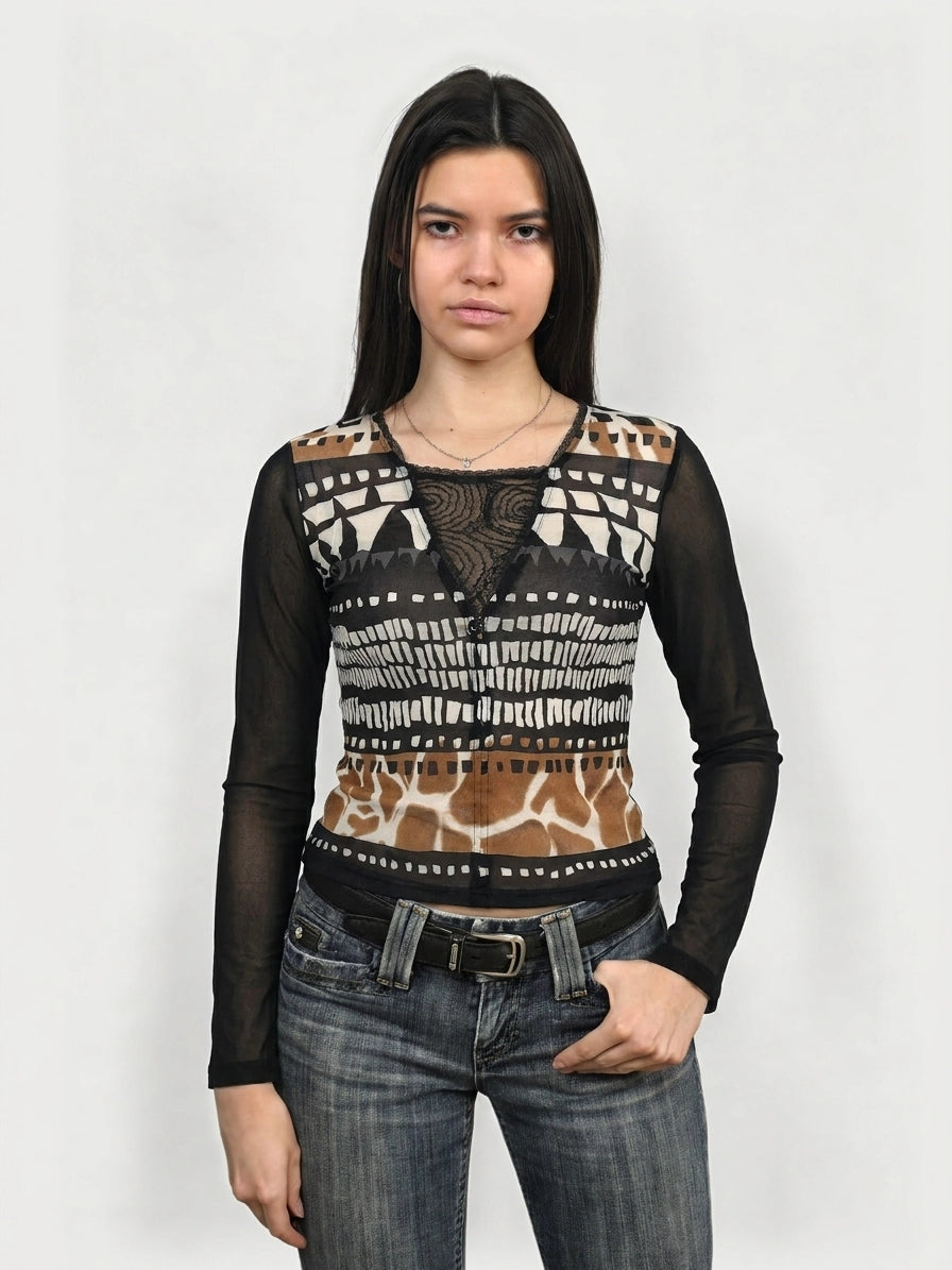 Front view of a patterned long sleeve top featuring sheer detail and earthy colors.