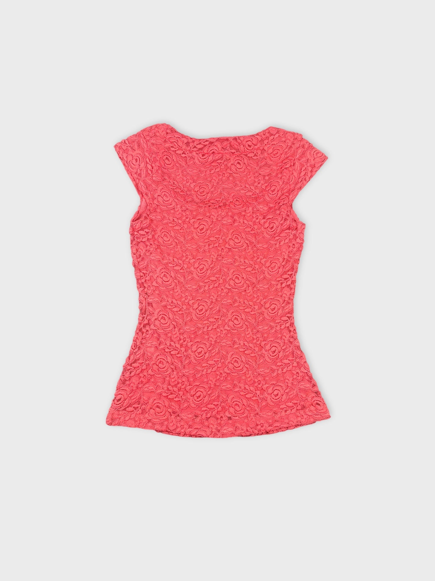 Back view of a pink floral lace crop top with short sleeves.