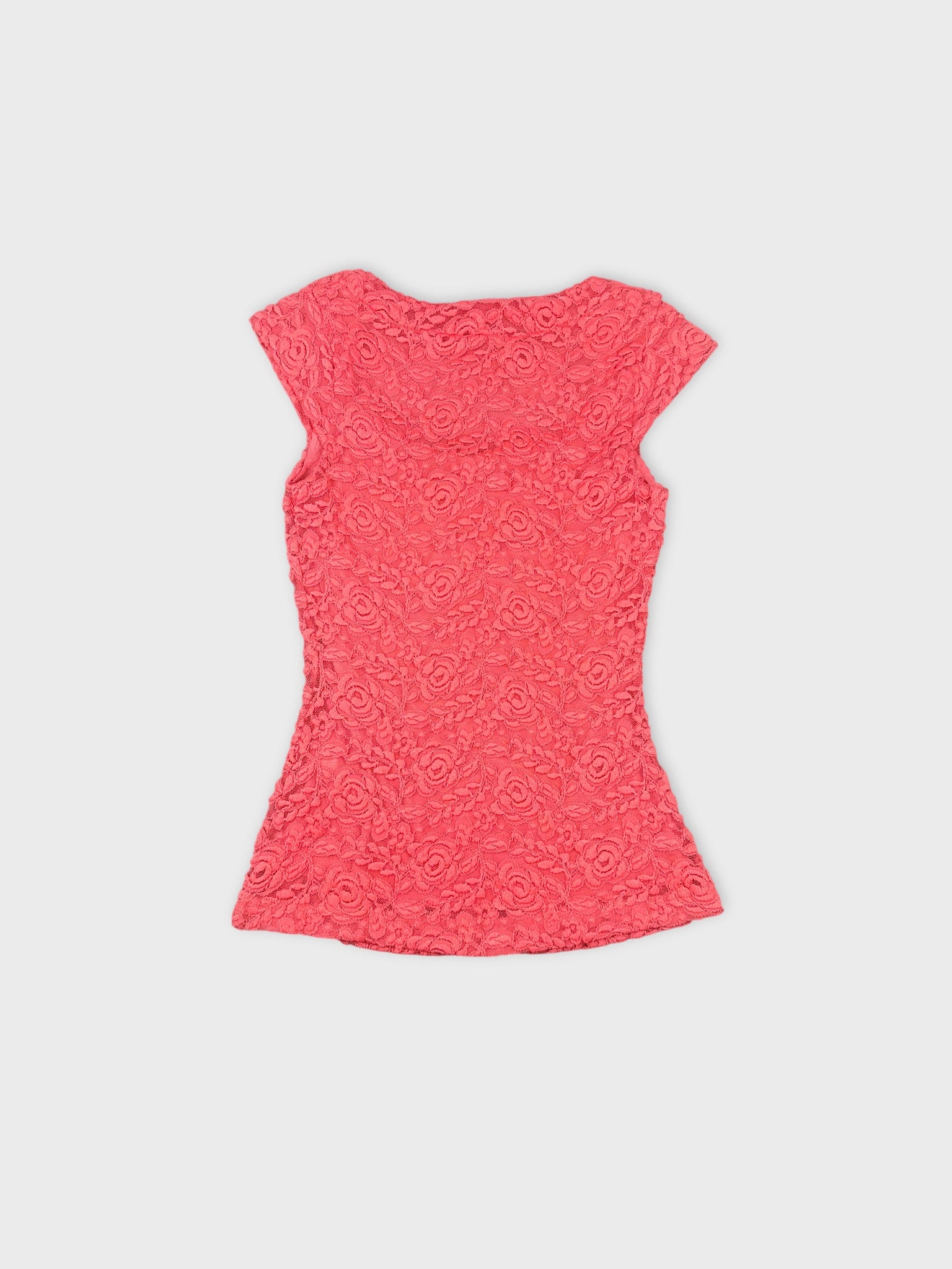 Back view of a pink floral lace crop top with short sleeves.