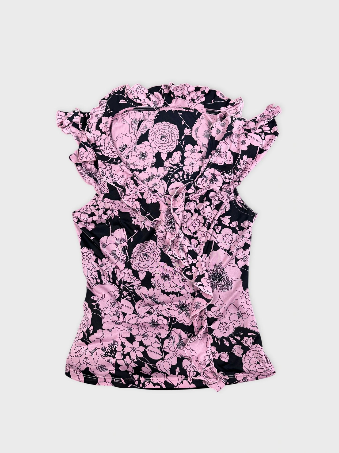 Pink floral vintage corset dress in a front view with ruffled trim.