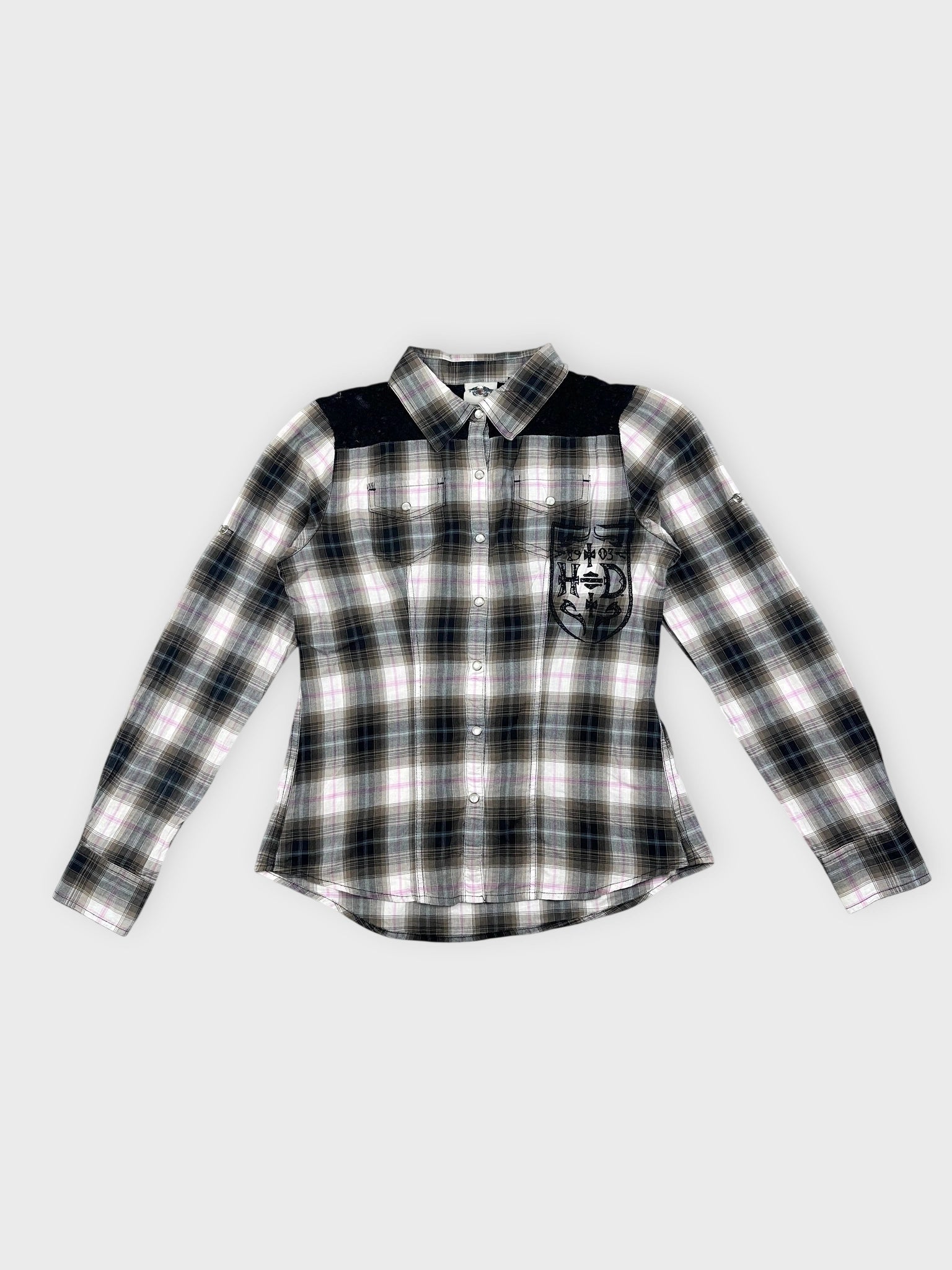 Plaid button-up shirt in black and white with a front view pocket detail.