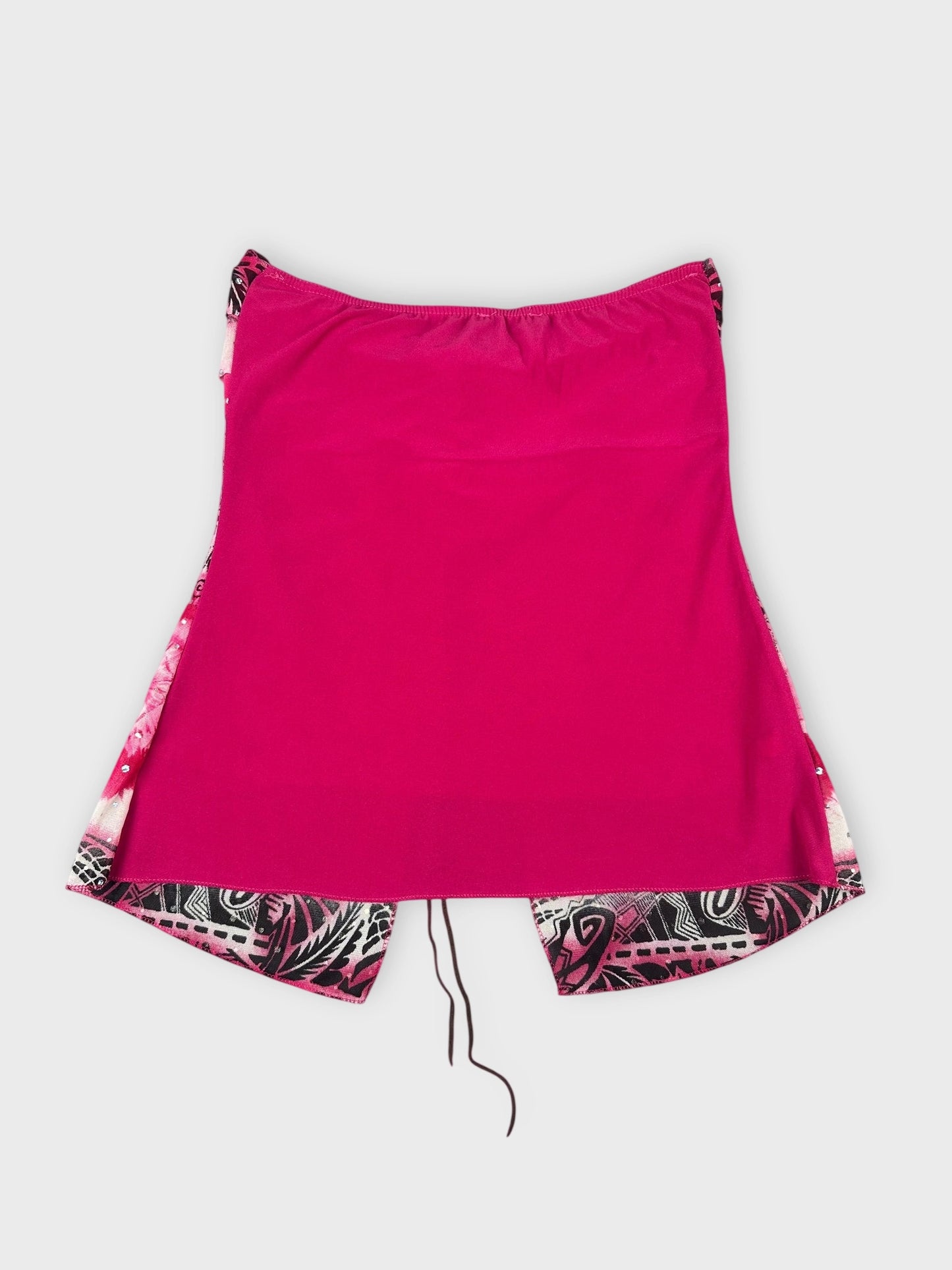 Back view of a psychedelic strapless top in bright pink with detailed print.