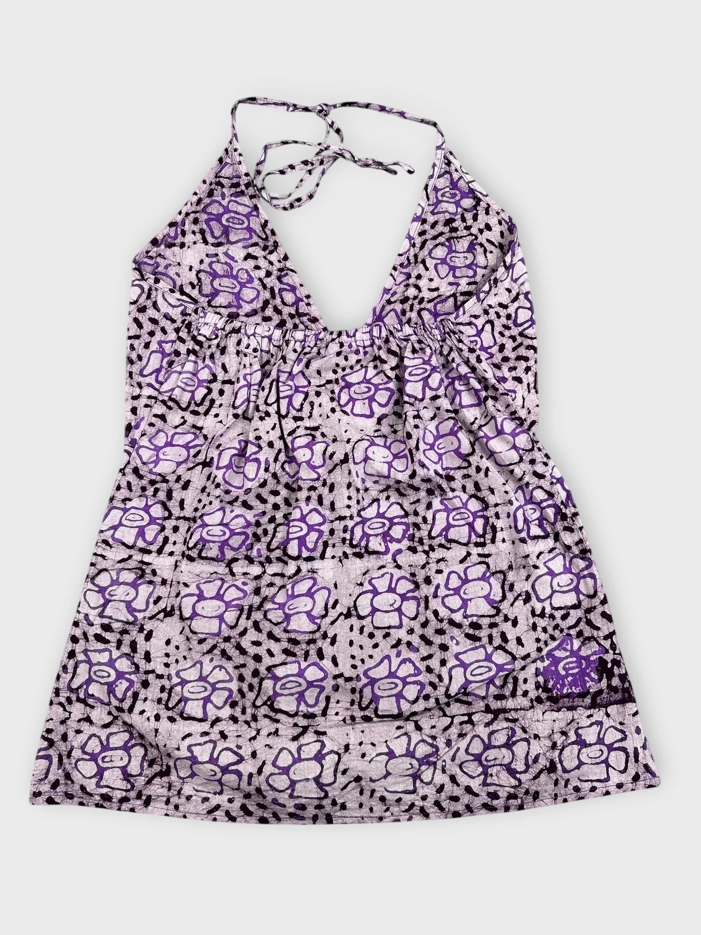 Back view of purple floral halter top with tie detailing
