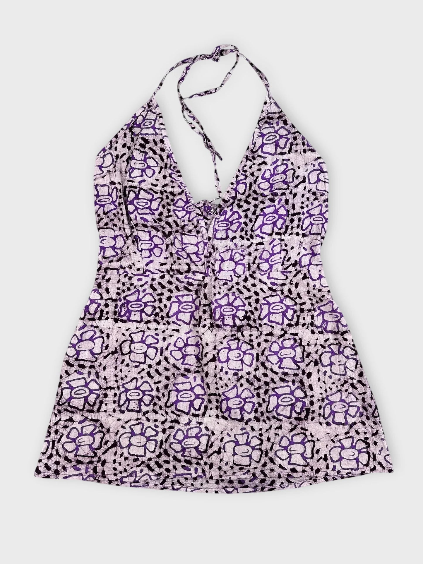 Purple floral halter top with tie featuring a deep V-neck, front view.