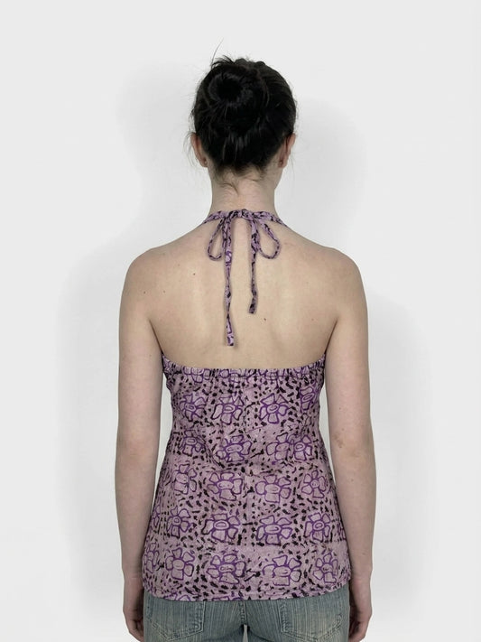 Back view of purple floral halter top with tie detail.