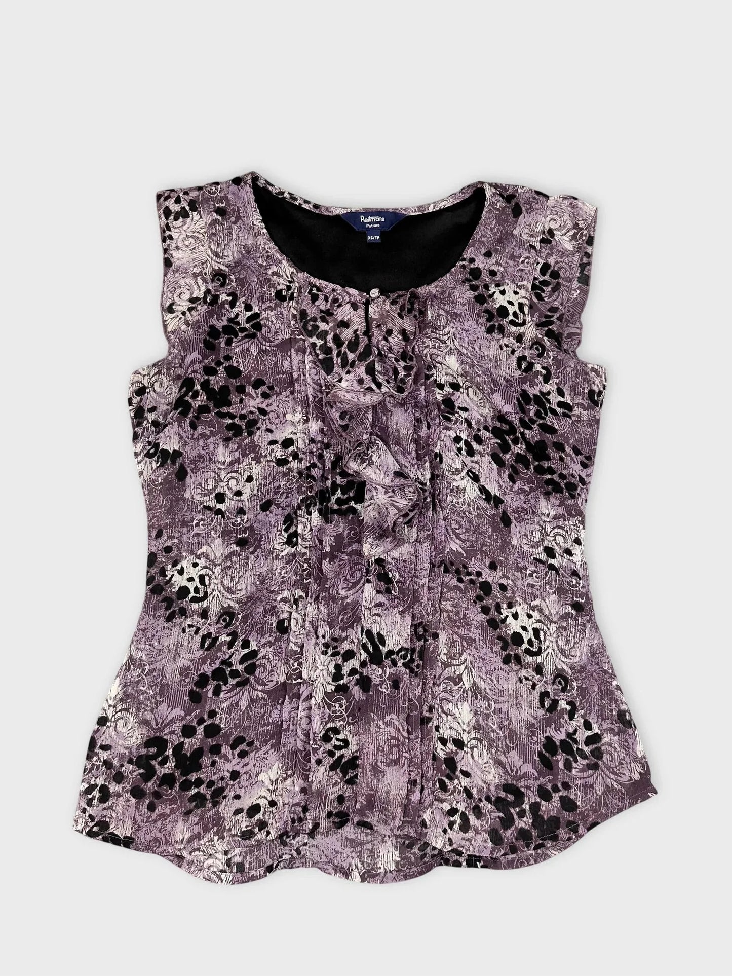 Front view of a purple floral lace top with a keyhole detail.