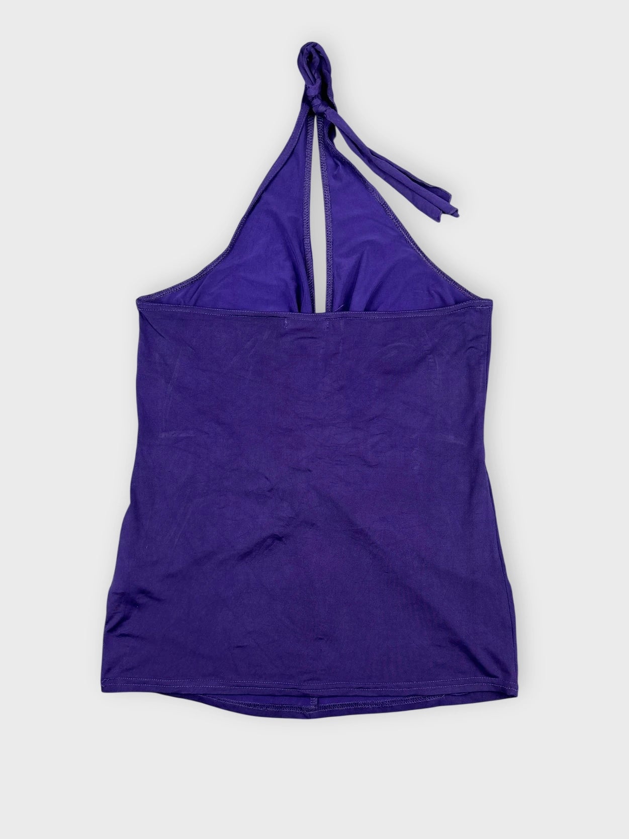 Back view of a purple halter top featuring a ring detail.