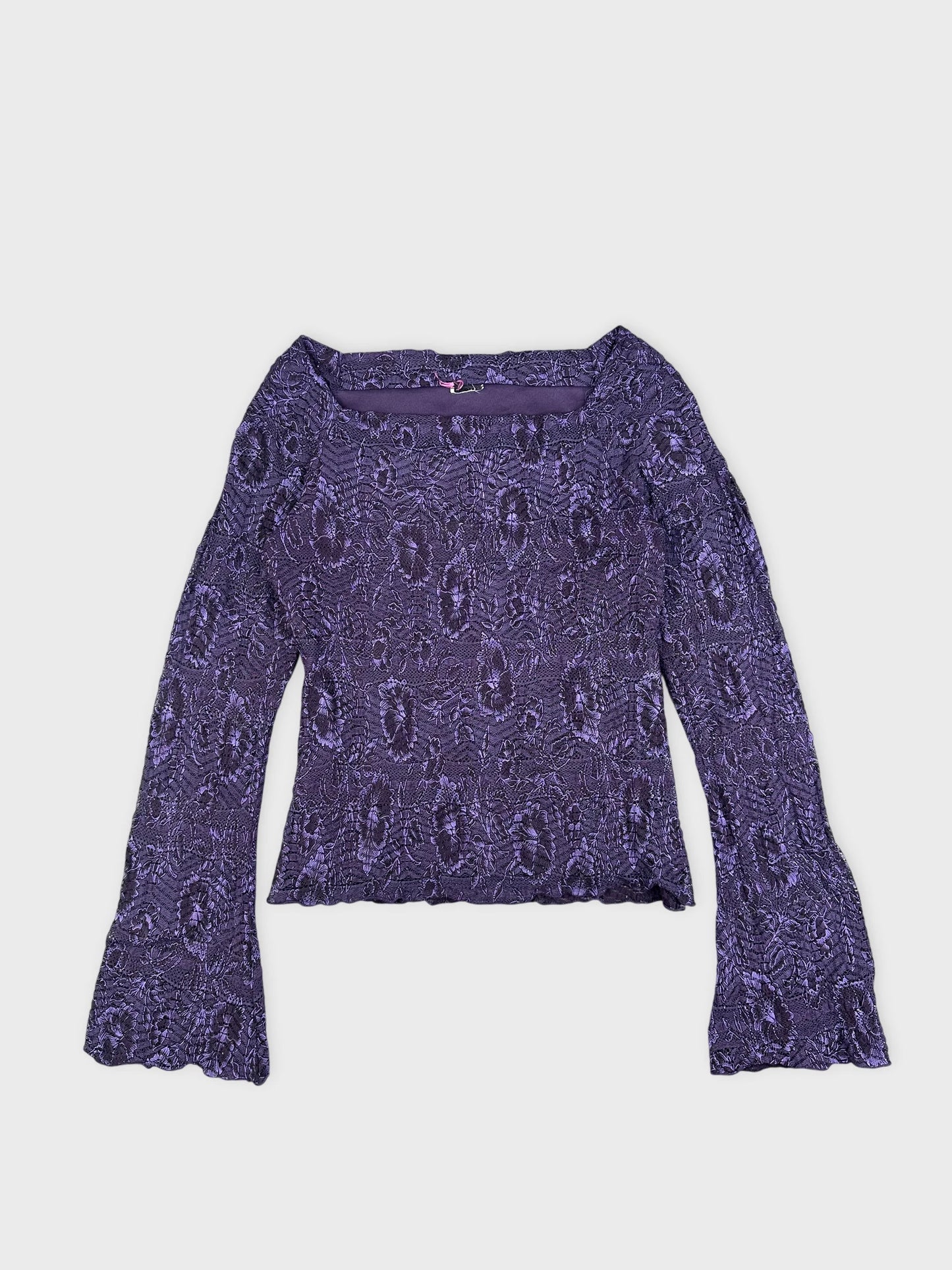 Detail view of a purple lace long-sleeve crop top with flared sleeves.
