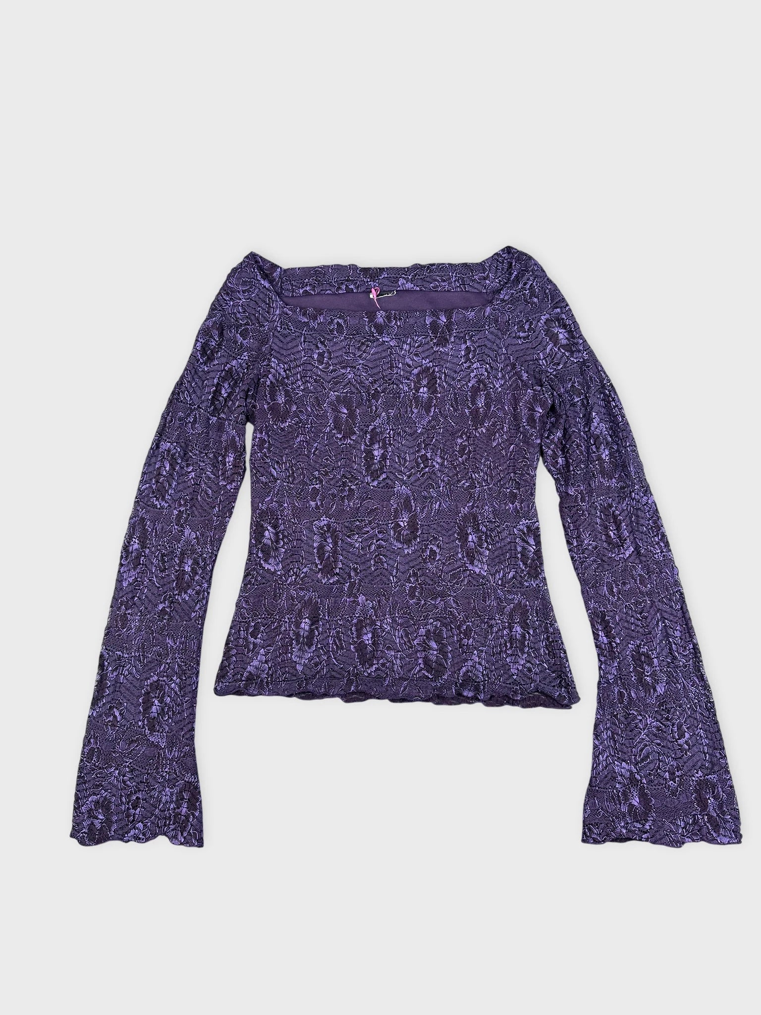 Front view of a purple lace long-sleeve crop top featuring flared sleeves.