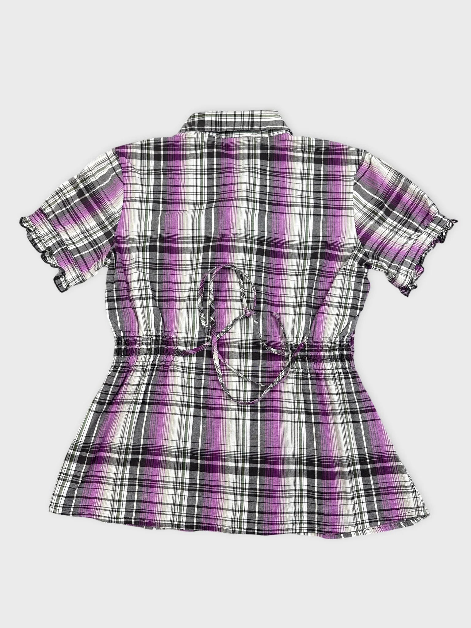 Back view of a purple plaid peplum shirt with ruched detailing
