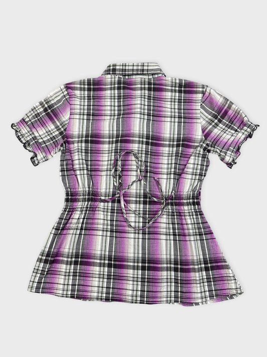 Back view of a purple plaid peplum shirt with ruched detailing
