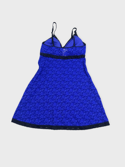Back view of royal blue mini dress with black lace trim.