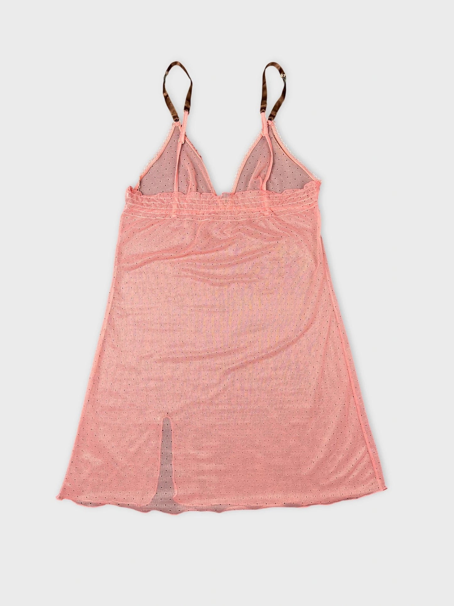 Back view of sheer pink top featuring strappy detail and V-neck