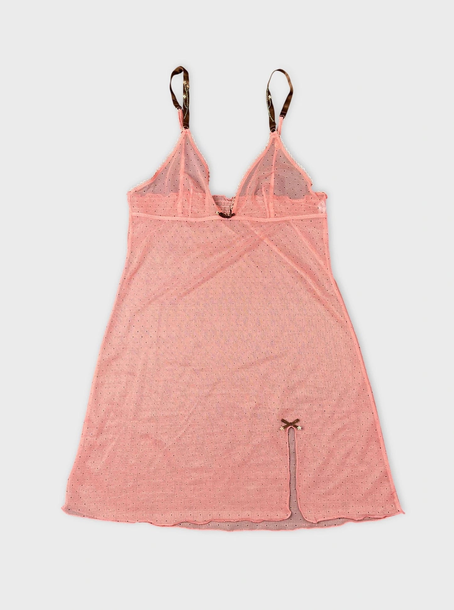Sheer pink top with strappy detail front view