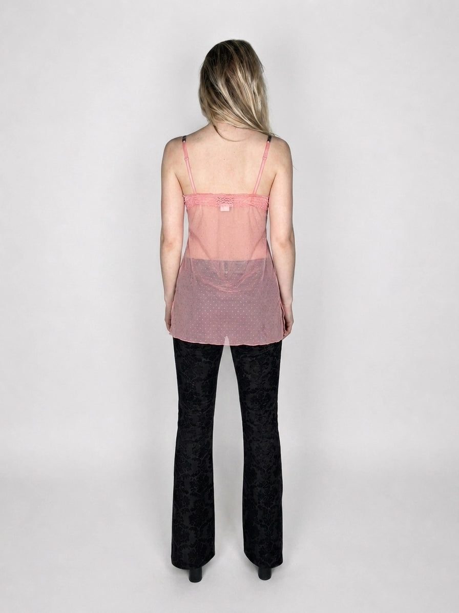 Back view of sheer pink top featuring cute strappy detail.