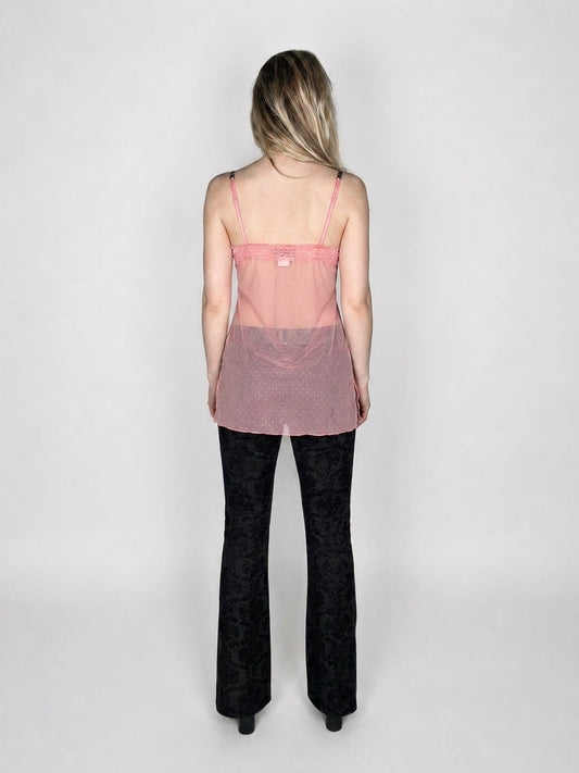 Back view of sheer pink top featuring cute strappy detail.