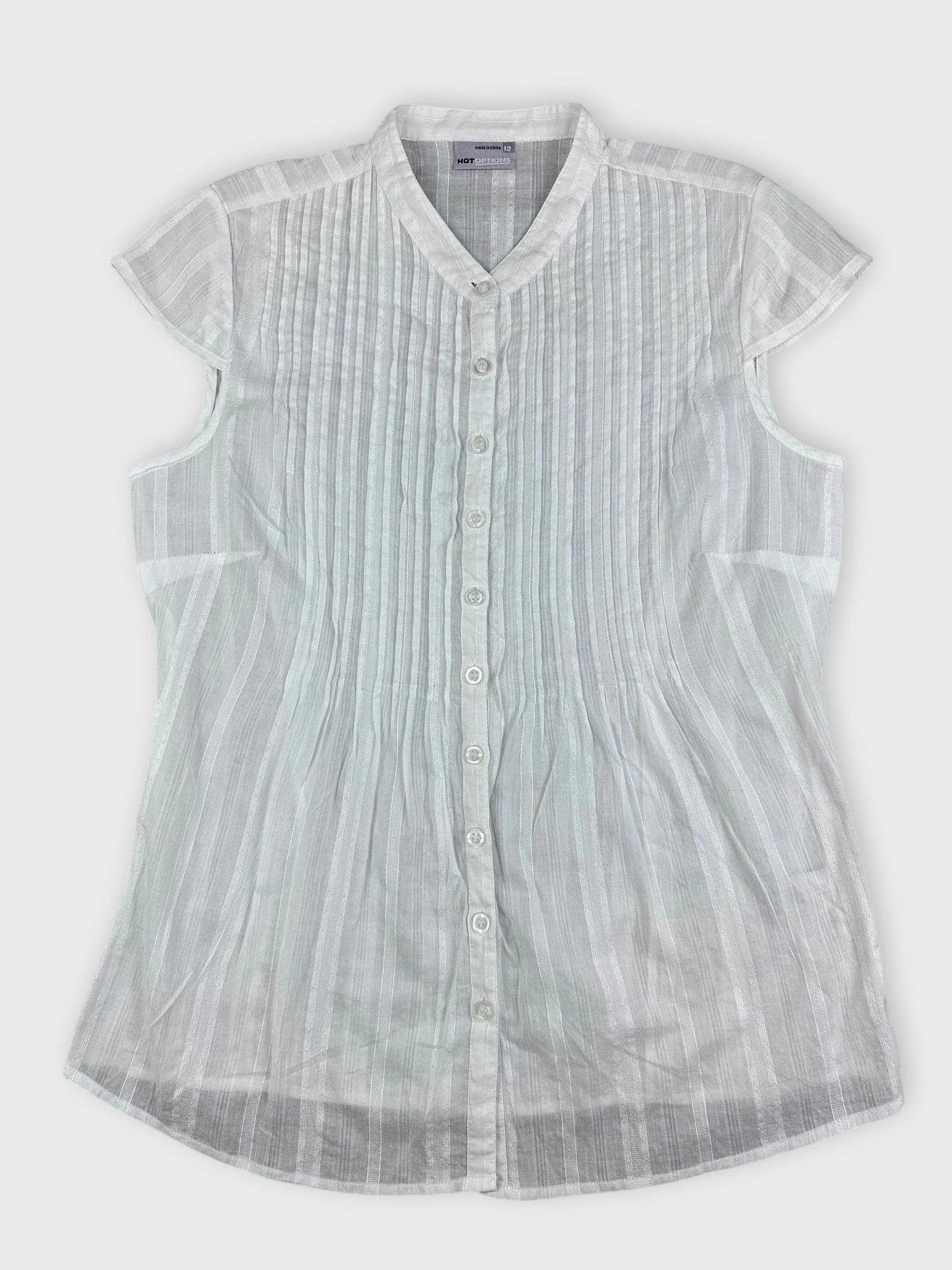 Sheer white blouse with pintuck detailing in front view.