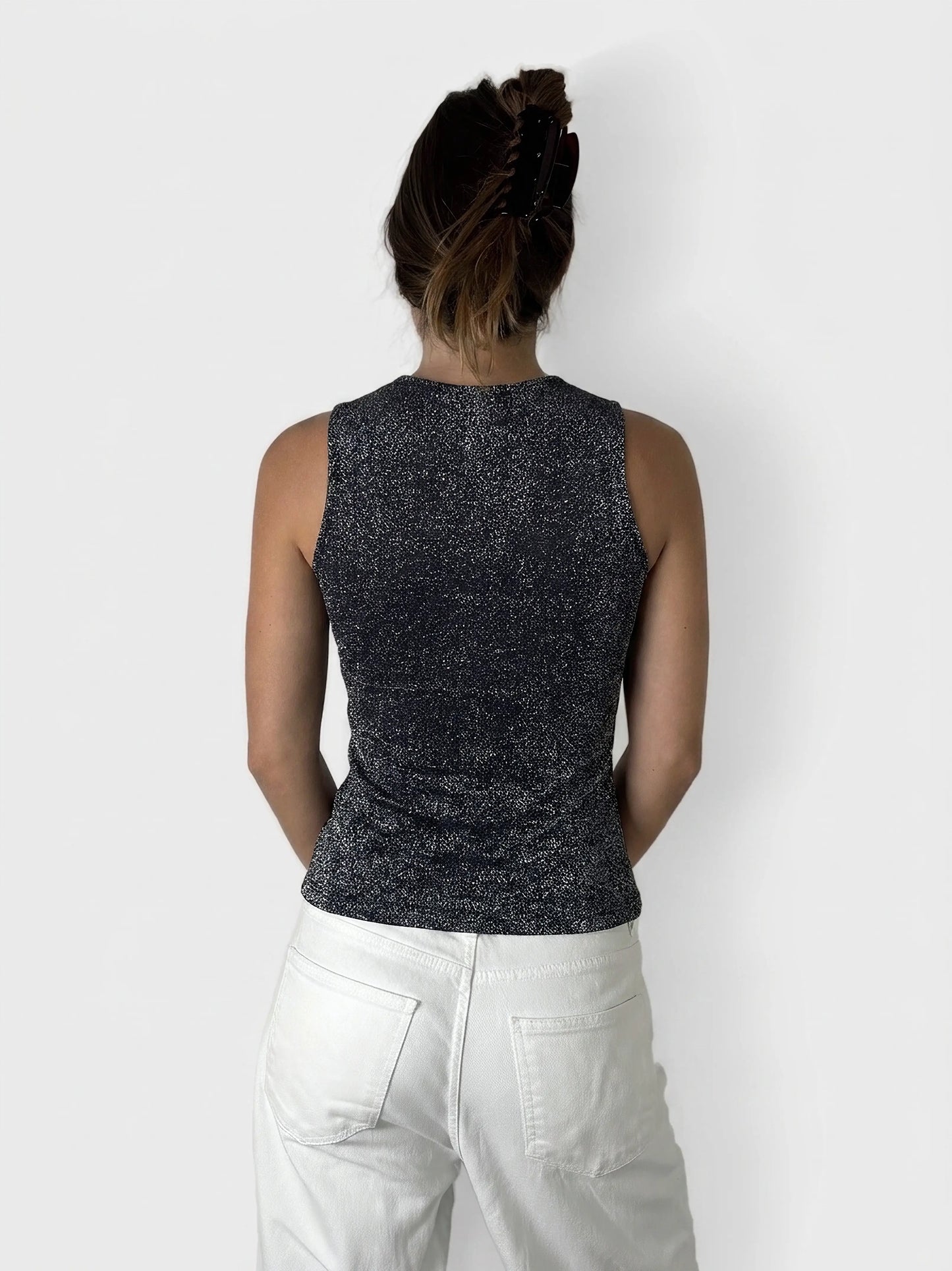 Back view of a shimmering lurex tank top in dark blue.